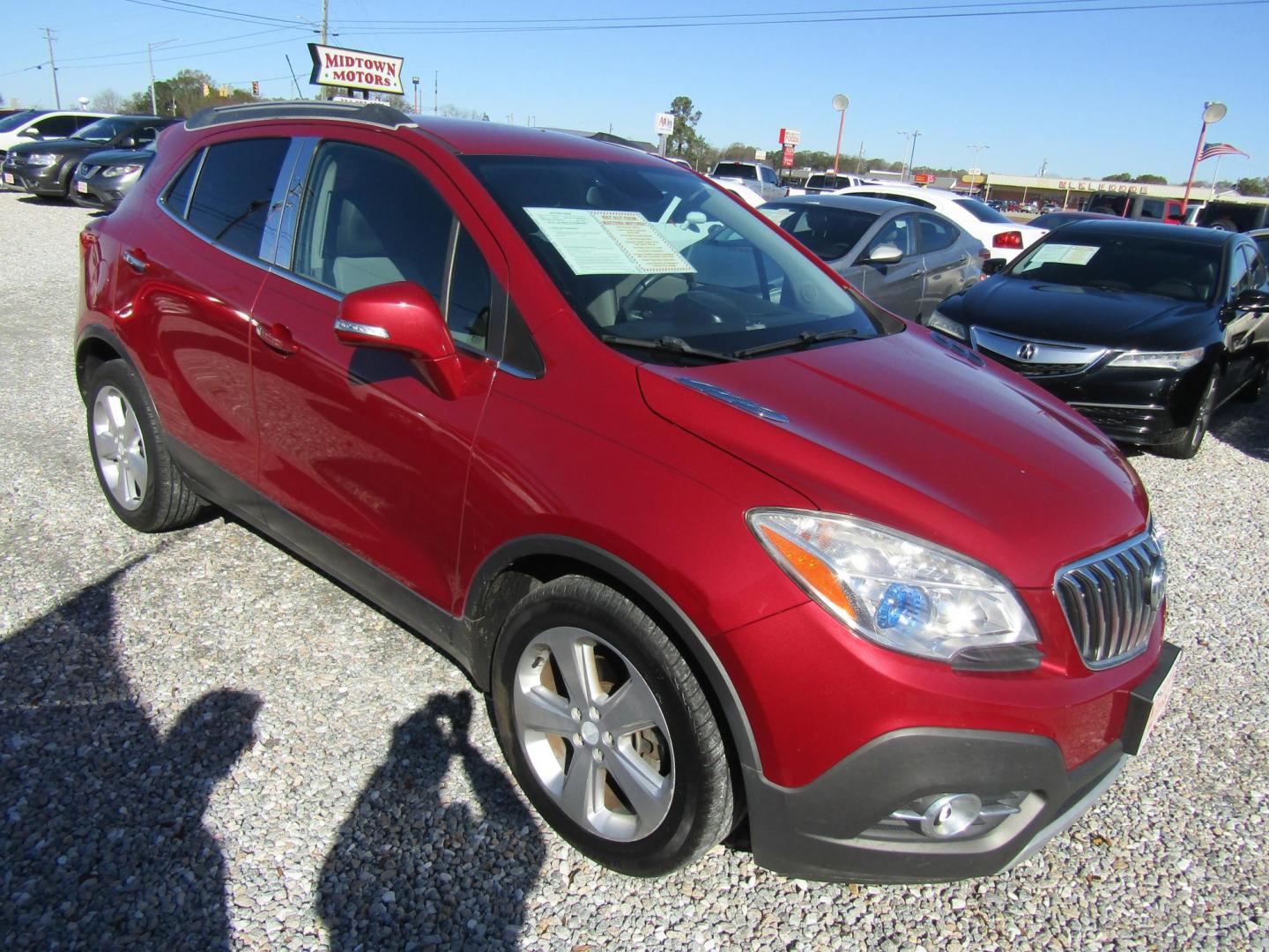 2015 Red Buick Encore Leather FWD (KL4CJCSB6FB) with an 1.4L L4 DOHC 16V TURBO engine, Automatic transmission, located at 15016 S Hwy 231, Midland City, AL, 36350, (334) 983-3001, 31.306210, -85.495277 - Photo#0