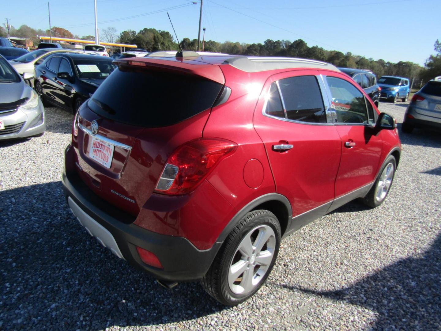 2015 Red Buick Encore Leather FWD (KL4CJCSB6FB) with an 1.4L L4 DOHC 16V TURBO engine, Automatic transmission, located at 15016 S Hwy 231, Midland City, AL, 36350, (334) 983-3001, 31.306210, -85.495277 - Photo#7