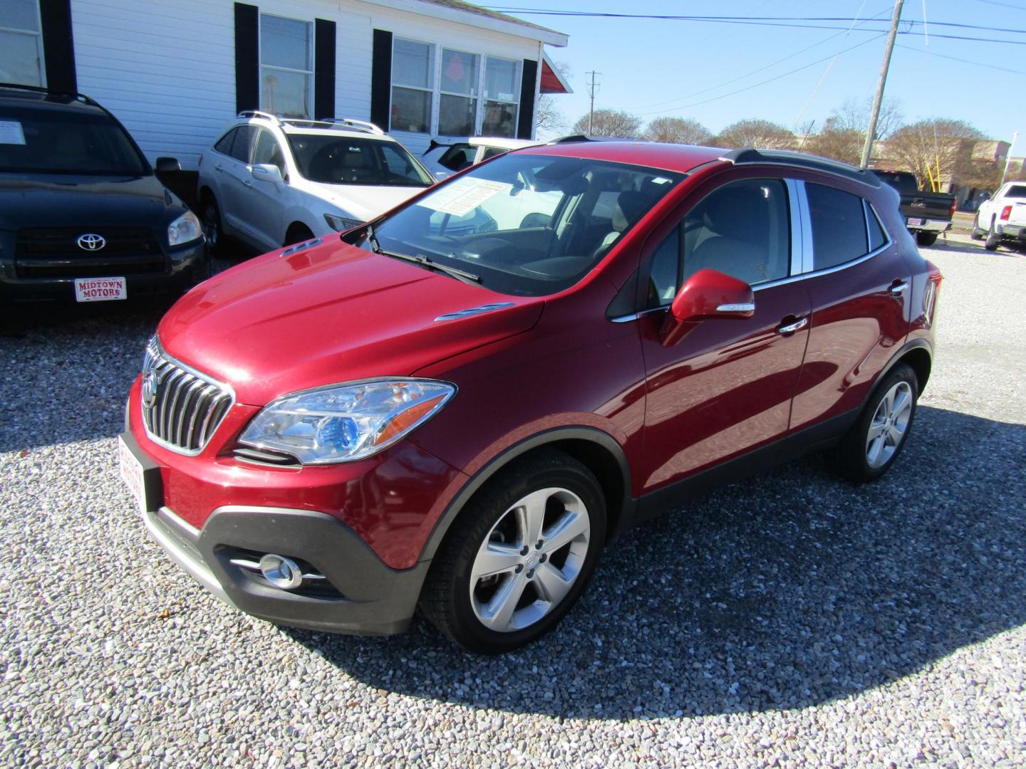 2015 Red Buick Encore Leather FWD (KL4CJCSB6FB) with an 1.4L L4 DOHC 16V TURBO engine, Automatic transmission, located at 15016 S Hwy 231, Midland City, AL, 36350, (334) 983-3001, 31.306210, -85.495277 - Photo#2