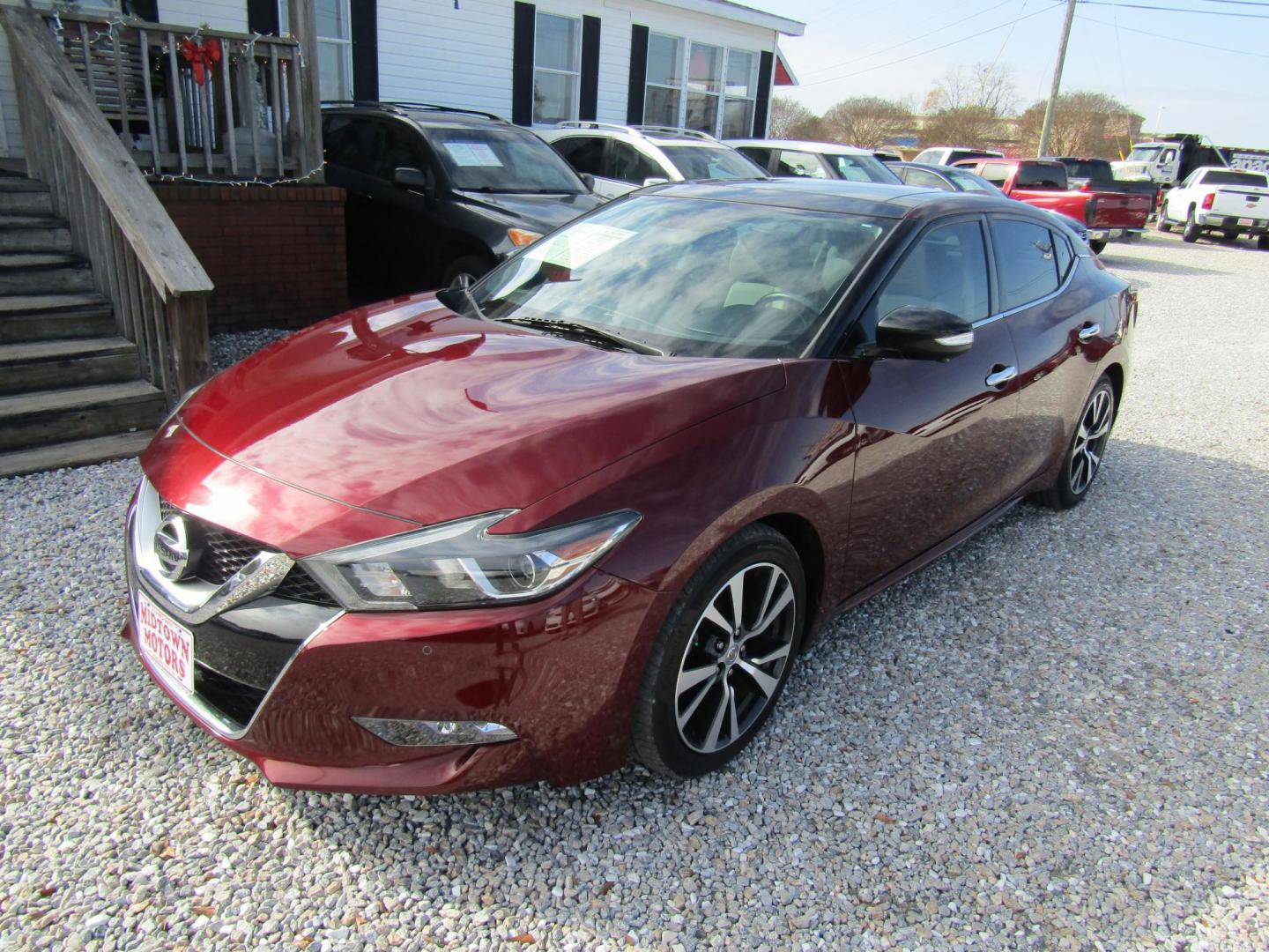 2016 Red Nissan Maxima 3.5 S (1N4AA6AP1GC) with an 3.5L V6 DOHC 24V engine, Automatic transmission, located at 15016 S Hwy 231, Midland City, AL, 36350, (334) 983-3001, 31.306210, -85.495277 - Photo#2
