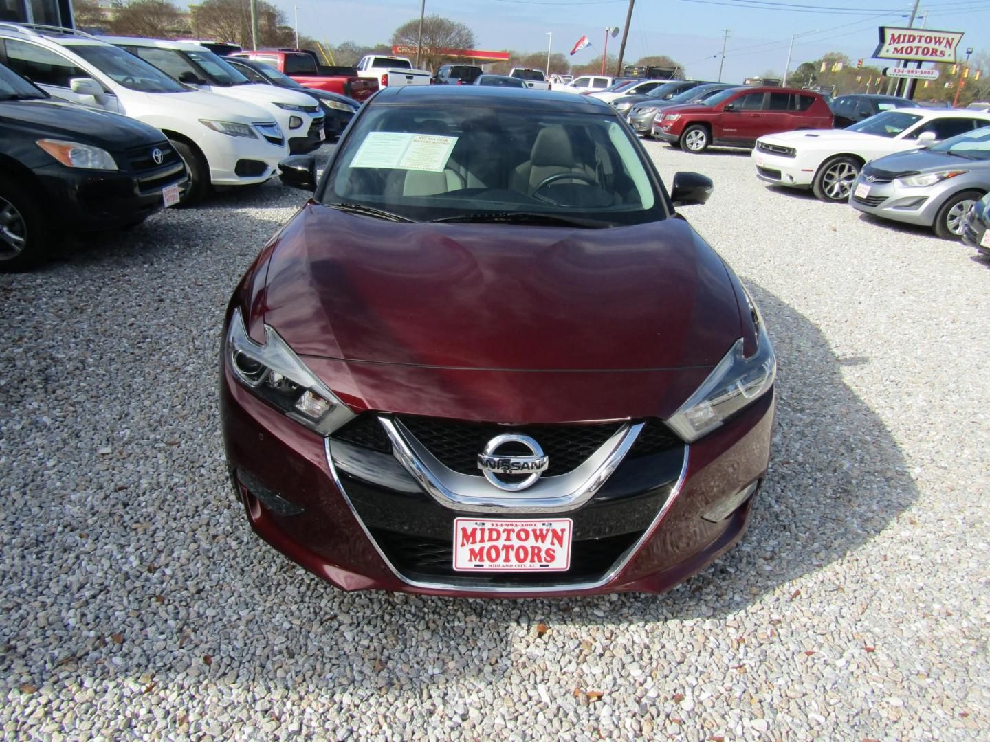 2016 Red Nissan Maxima 3.5 S (1N4AA6AP1GC) with an 3.5L V6 DOHC 24V engine, Automatic transmission, located at 15016 S Hwy 231, Midland City, AL, 36350, (334) 983-3001, 31.306210, -85.495277 - Photo#1