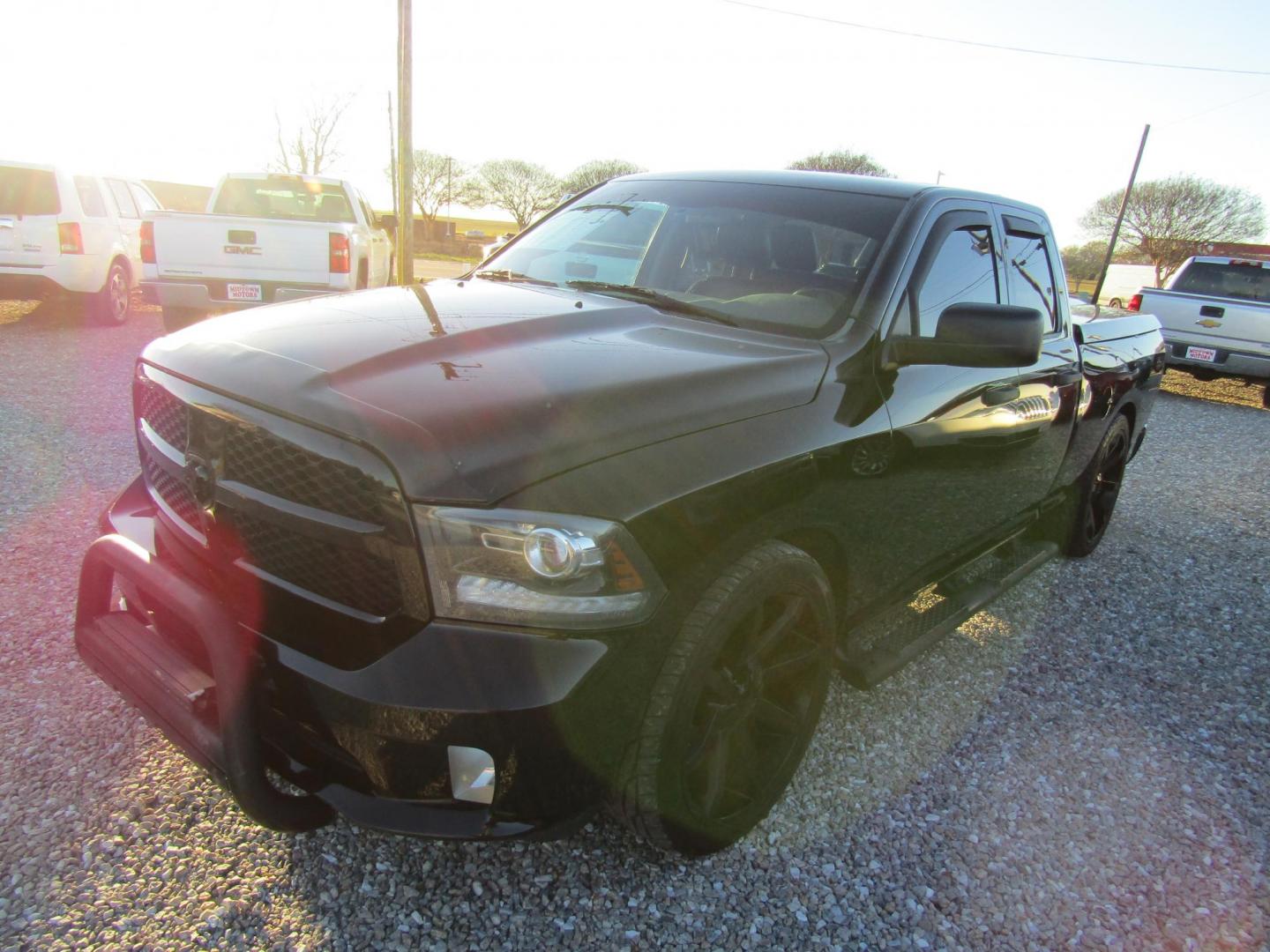 2014 Black RAM 1500 Tradesman Quad Cab 2WD (1C6RR6FT4ES) with an 5.7L V8 OHV 16V engine, Automatic transmission, located at 15016 S Hwy 231, Midland City, AL, 36350, (334) 983-3001, 31.306210, -85.495277 - Photo#1