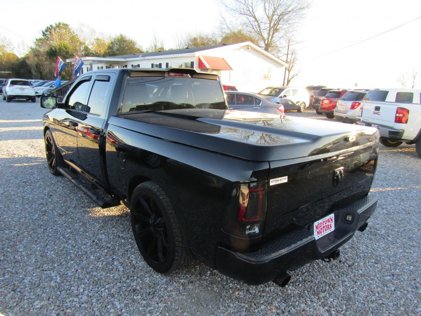 2014 Black RAM 1500 Tradesman Quad Cab 2WD (1C6RR6FT4ES) with an 5.7L V8 OHV 16V engine, Automatic transmission, located at 15016 S Hwy 231, Midland City, AL, 36350, (334) 983-3001, 31.306210, -85.495277 - Photo#4