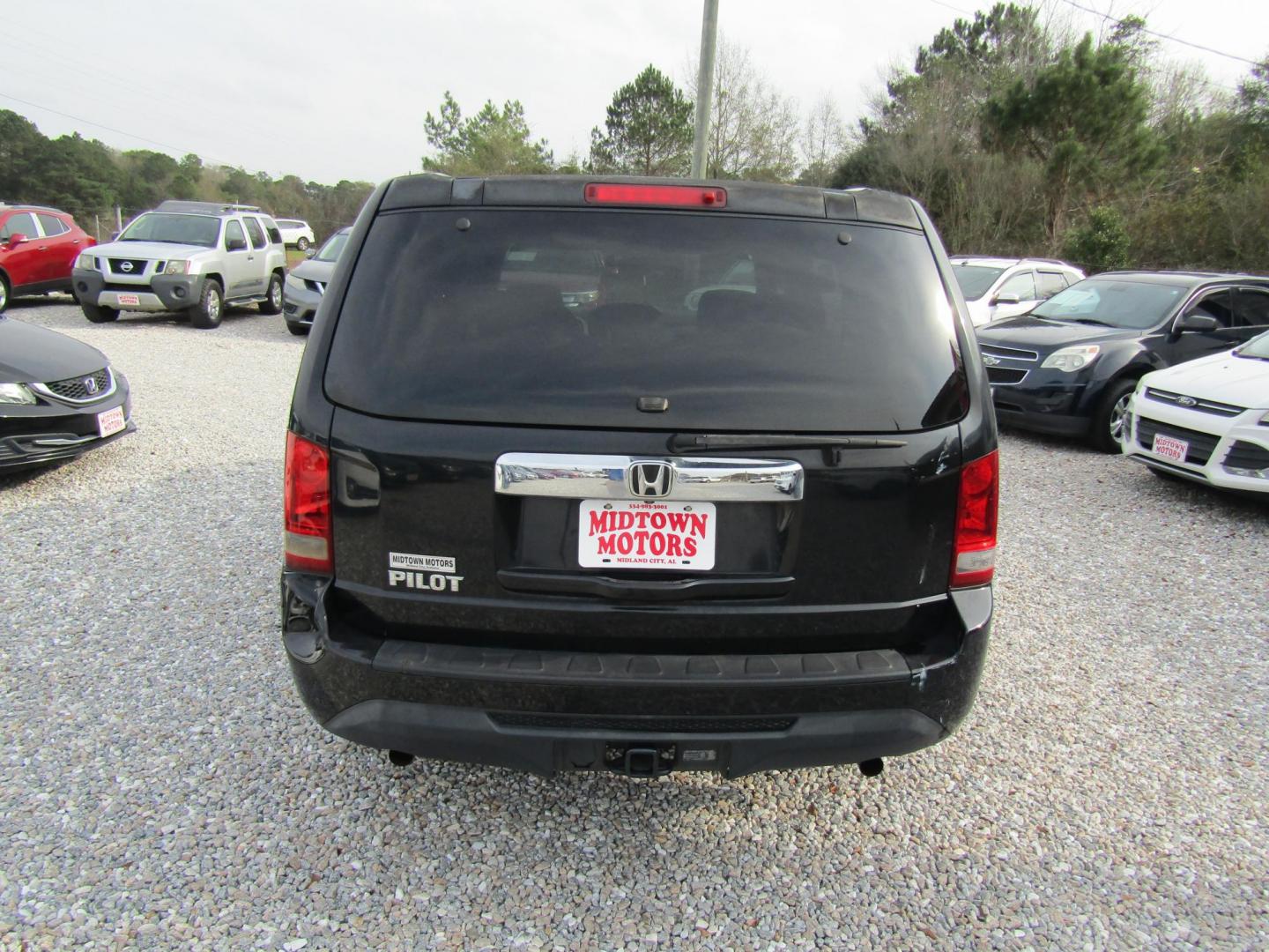 2013 Black Honda Pilot LX 2WD 5-Spd AT (5FNYF3H20DB) with an 3.5L V6 SOHC 24V engine, Automatic transmission, located at 15016 S Hwy 231, Midland City, AL, 36350, (334) 983-3001, 31.306210, -85.495277 - Photo#5