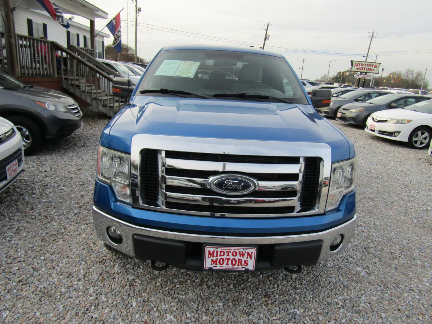 2012 Blue Ford F-150 Lariat SuperCab 6.5-ft. Bed 4WD (1FTFX1EF1CF) with an 5.0L V8 engine, Automatic transmission, located at 15016 S Hwy 231, Midland City, AL, 36350, (334) 983-3001, 31.306210, -85.495277 - Photo#1
