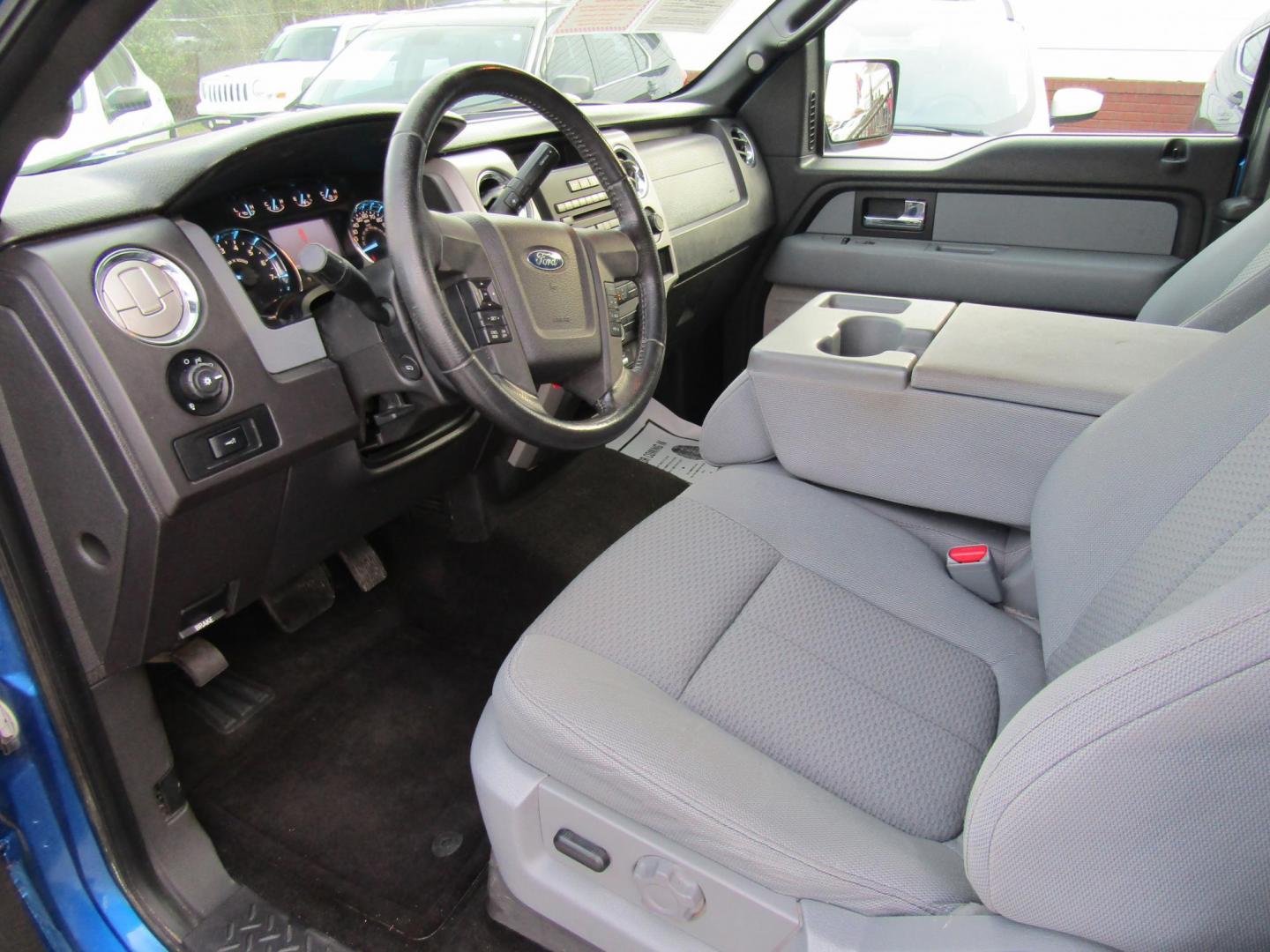 2012 Blue Ford F-150 Lariat SuperCab 6.5-ft. Bed 4WD (1FTFX1EF1CF) with an 5.0L V8 engine, Automatic transmission, located at 15016 S Hwy 231, Midland City, AL, 36350, (334) 983-3001, 31.306210, -85.495277 - Photo#3