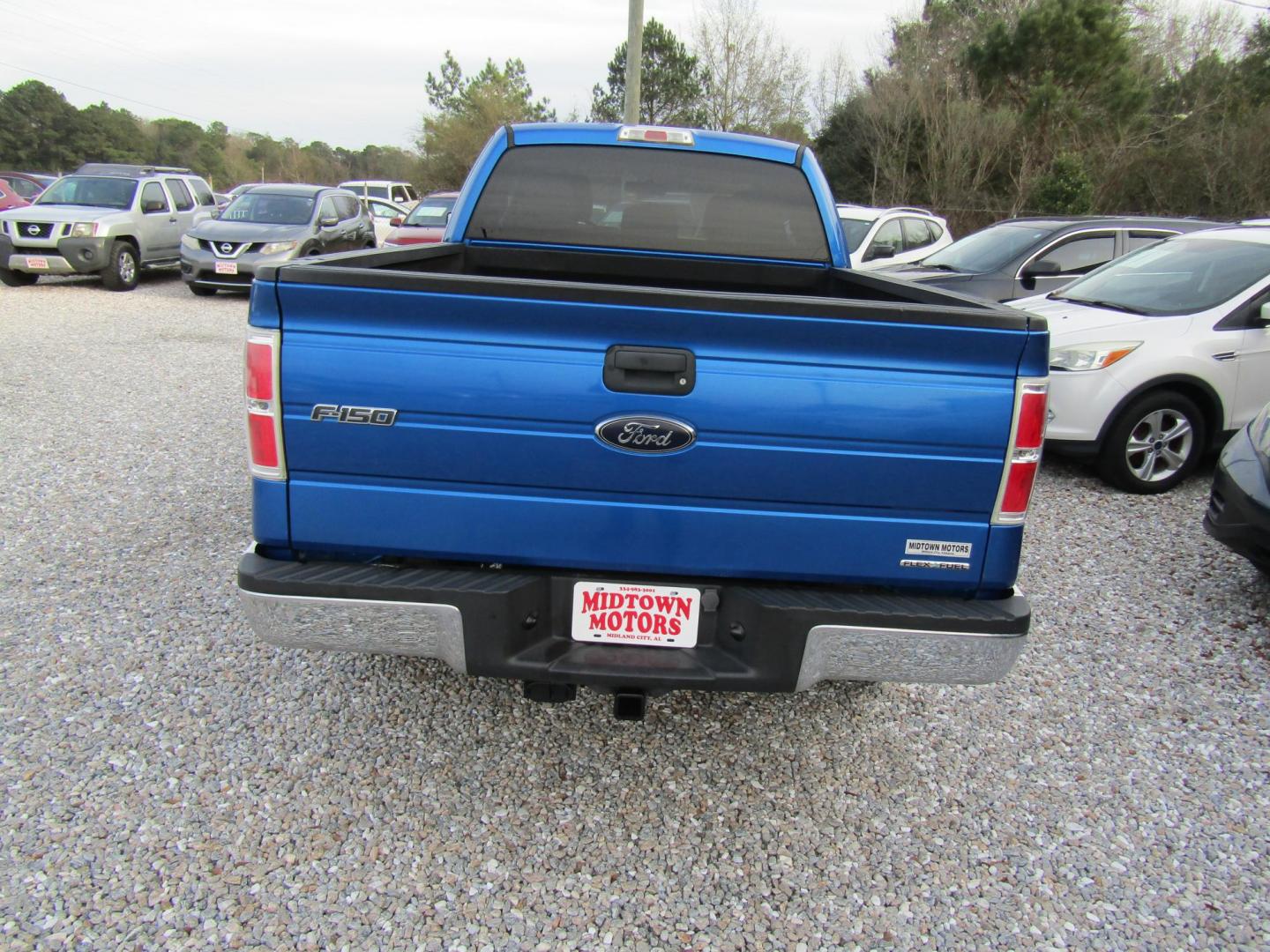 2012 Blue Ford F-150 Lariat SuperCab 6.5-ft. Bed 4WD (1FTFX1EF1CF) with an 5.0L V8 engine, Automatic transmission, located at 15016 S Hwy 231, Midland City, AL, 36350, (334) 983-3001, 31.306210, -85.495277 - Photo#6