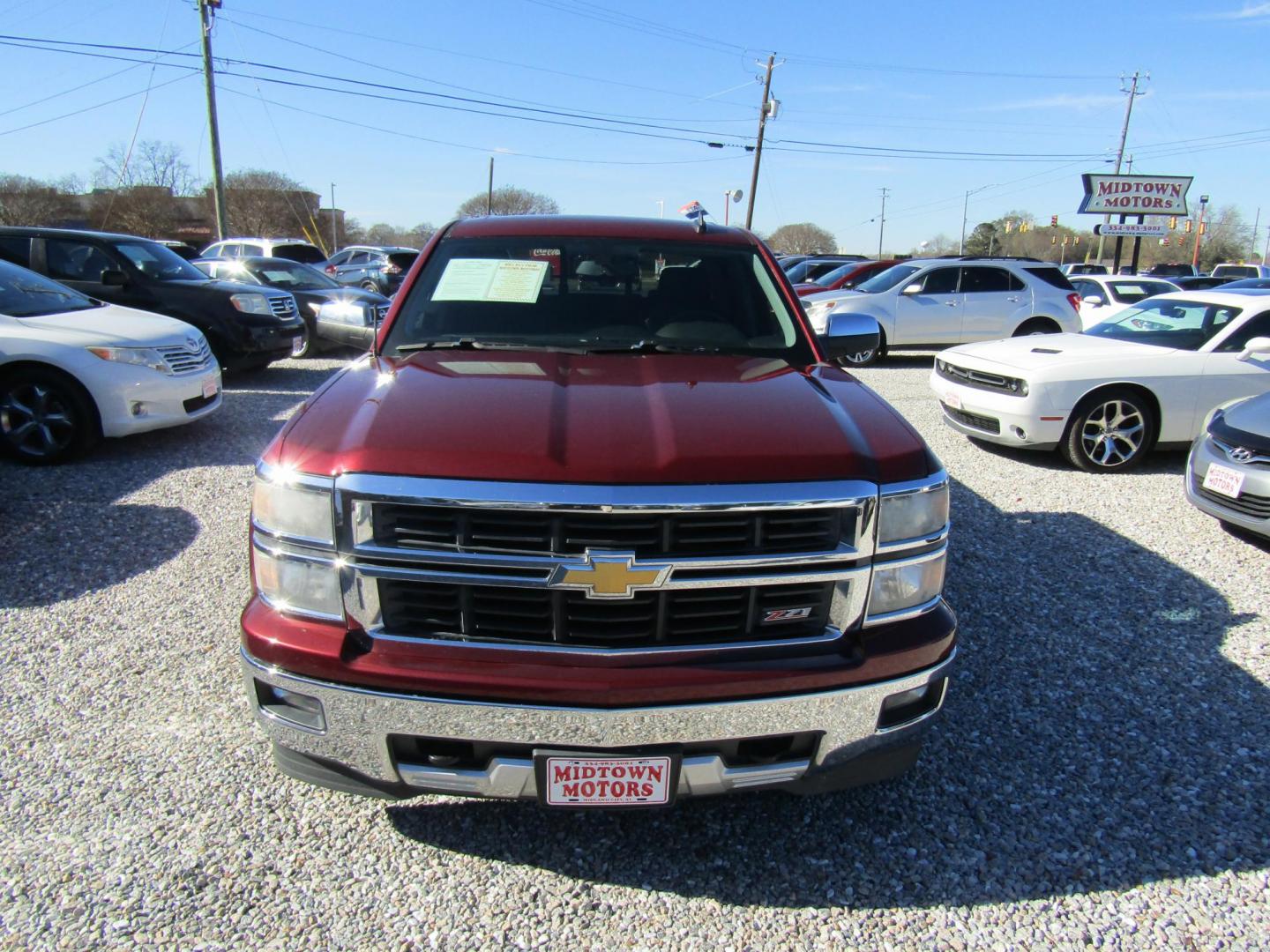 2015 Red Chevrolet Silverado 1500 LT Crew Cab 4WD (3GCUKRECXFG) with an 5.3L V8 OHV 16V engine, Automatic transmission, located at 15016 S Hwy 231, Midland City, AL, 36350, (334) 983-3001, 31.306210, -85.495277 - Photo#1
