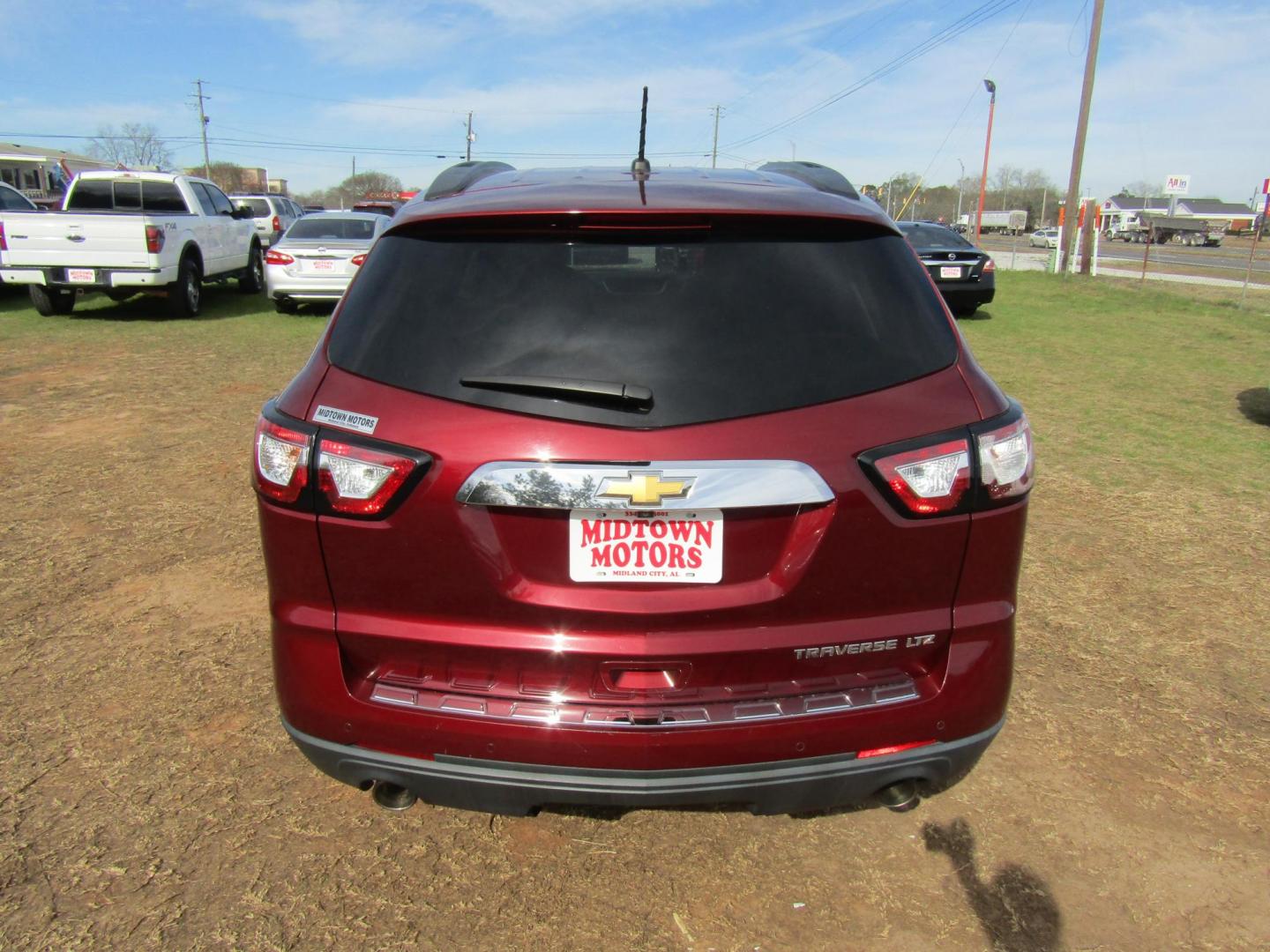 2015 Red Chevrolet Traverse LTZ FWD (1GNKRJKDXFJ) with an 3.6L V6 DOHC 24V engine, Automatic transmission, located at 15016 S Hwy 231, Midland City, AL, 36350, (334) 983-3001, 31.306210, -85.495277 - Photo#4