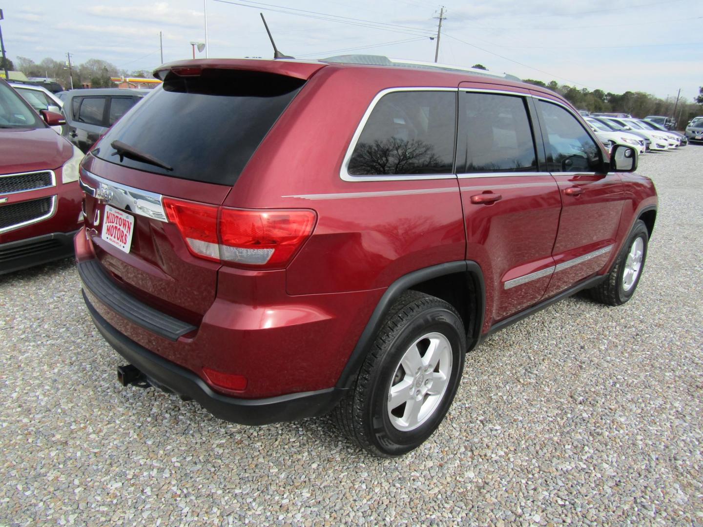 2012 Red Jeep Grand Cherokee Laredo 2WD (1C4RJEAGXCC) with an 3.6L V6 DOHC 24V engine, Automatic transmission, located at 15016 S Hwy 231, Midland City, AL, 36350, (334) 983-3001, 31.306210, -85.495277 - Photo#7