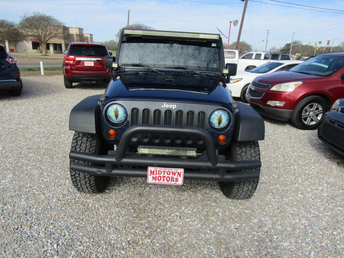 2013 Blue Jeep Wrangler Unlimited Sport 4WD (1C4BJWDGXDL) with an 3.6L V6 DOHC 24V FFV engine, Automatic transmission, located at 15016 S Hwy 231, Midland City, AL, 36350, (334) 983-3001, 31.306210, -85.495277 - Photo#1