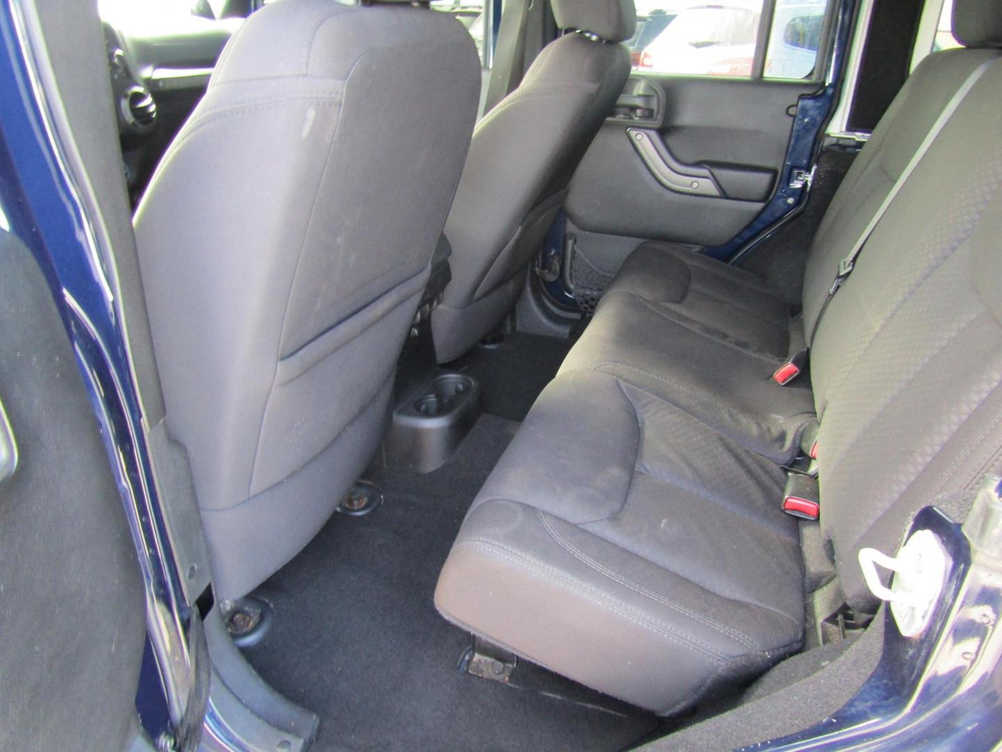 2013 Blue Jeep Wrangler Unlimited Sport 4WD (1C4BJWDGXDL) with an 3.6L V6 DOHC 24V FFV engine, Automatic transmission, located at 15016 S Hwy 231, Midland City, AL, 36350, (334) 983-3001, 31.306210, -85.495277 - Photo#4