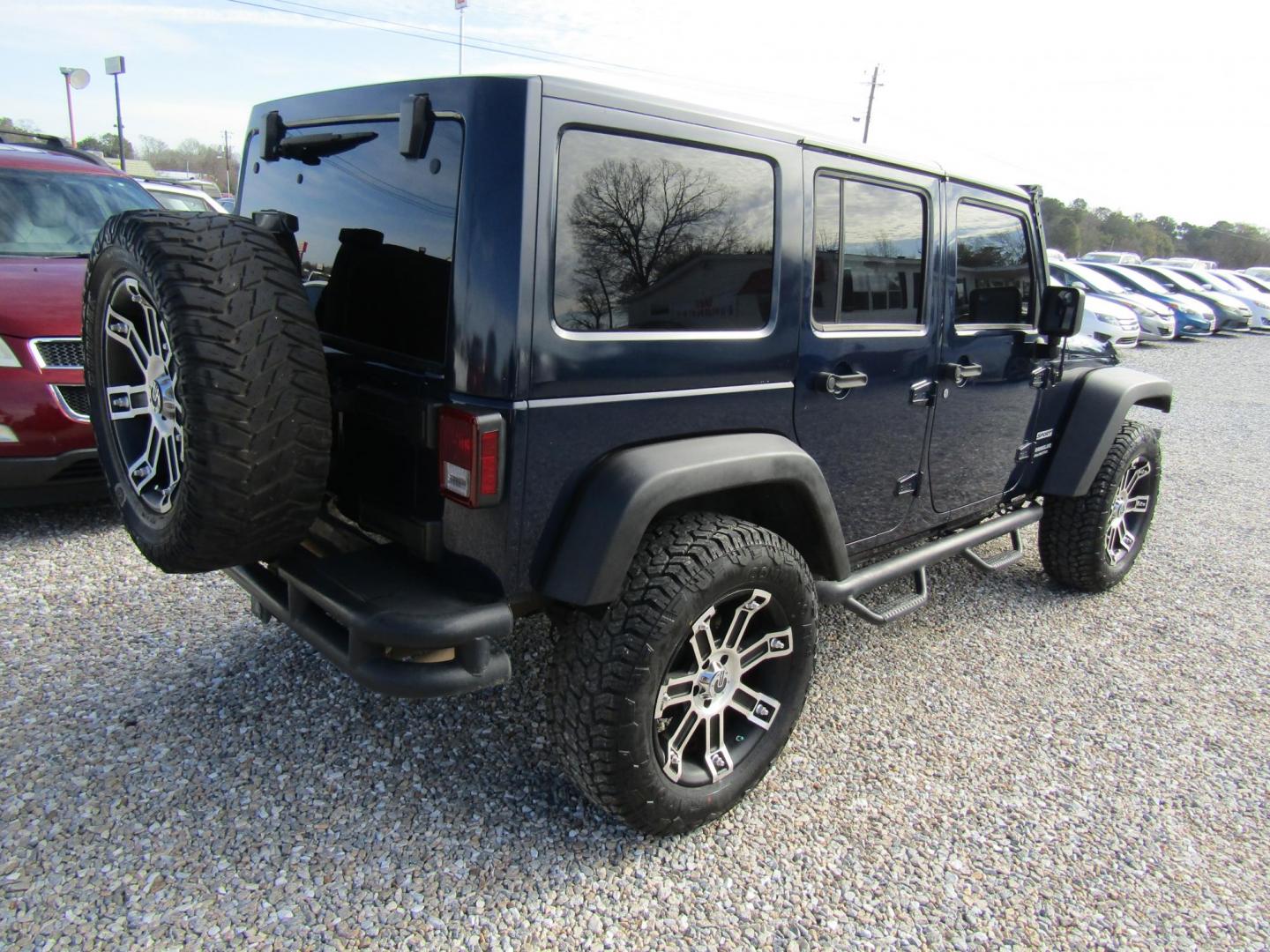 2013 Blue Jeep Wrangler Unlimited Sport 4WD (1C4BJWDGXDL) with an 3.6L V6 DOHC 24V FFV engine, Automatic transmission, located at 15016 S Hwy 231, Midland City, AL, 36350, (334) 983-3001, 31.306210, -85.495277 - Photo#7