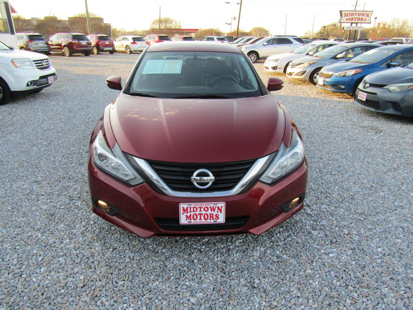 2016 Red Nissan Altima 2.5 SL (1N4AL3AP1GC) with an 2.5L L4 DOHC 16V engine, Automatic transmission, located at 15016 S Hwy 231, Midland City, AL, 36350, (334) 983-3001, 31.306210, -85.495277 - Photo#1