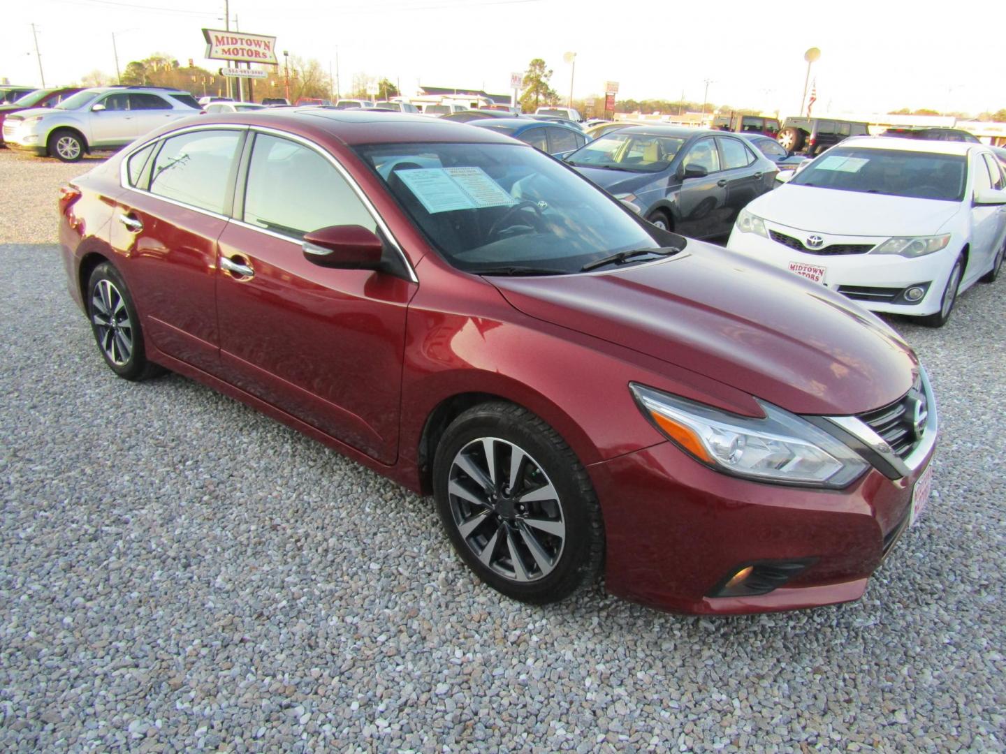 2016 Red Nissan Altima 2.5 SL (1N4AL3AP1GC) with an 2.5L L4 DOHC 16V engine, Automatic transmission, located at 15016 S Hwy 231, Midland City, AL, 36350, (334) 983-3001, 31.306210, -85.495277 - Photo#0