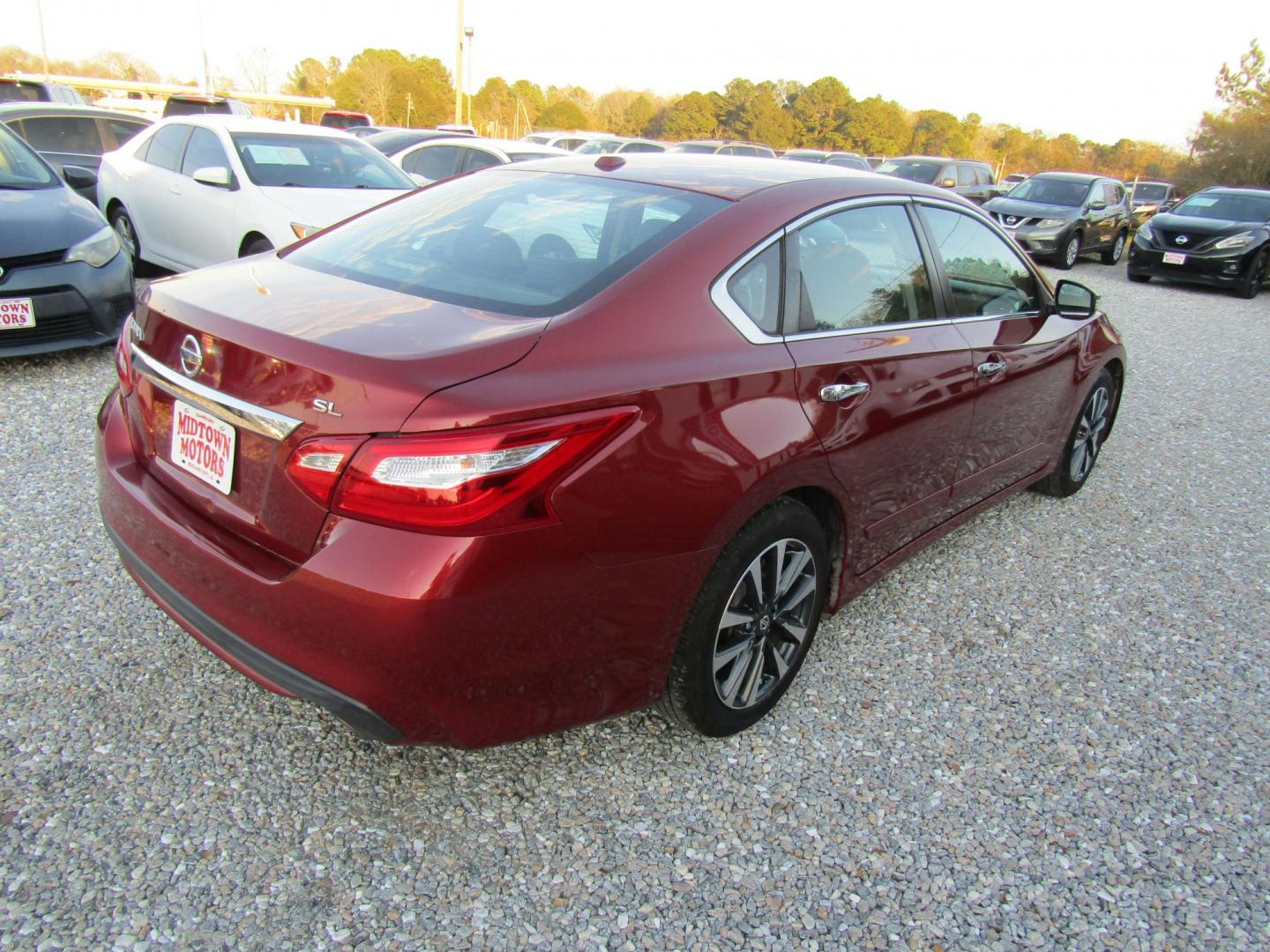 2016 Red Nissan Altima 2.5 SL (1N4AL3AP1GC) with an 2.5L L4 DOHC 16V engine, Automatic transmission, located at 15016 S Hwy 231, Midland City, AL, 36350, (334) 983-3001, 31.306210, -85.495277 - Photo#7