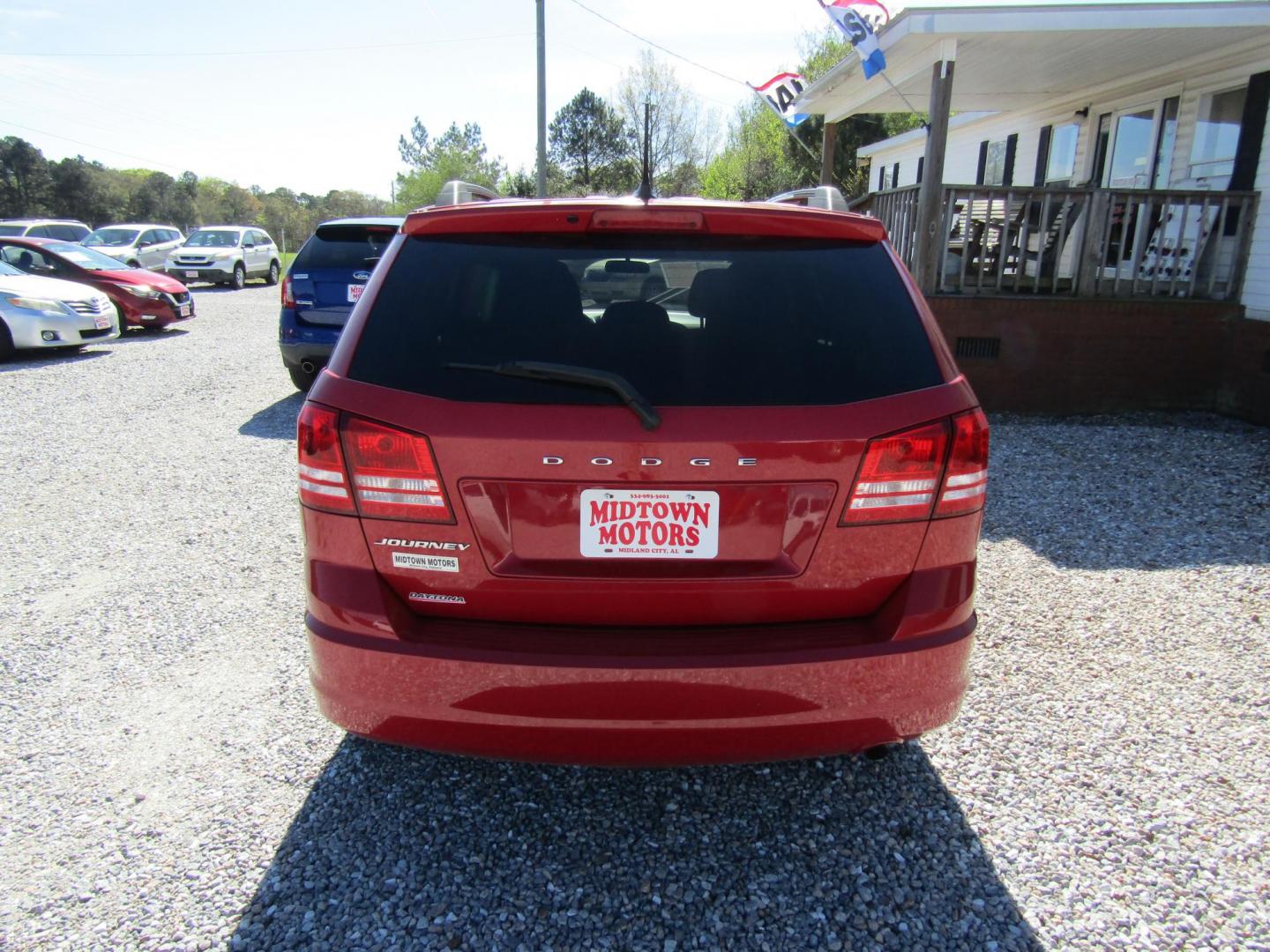 2018 Red Dodge Journey SE (3C4PDCAB5JT) with an 2.4L L4 DOHC 16V engine, Automatic transmission, located at 15016 S Hwy 231, Midland City, AL, 36350, (334) 983-3001, 31.306210, -85.495277 - Photo#6