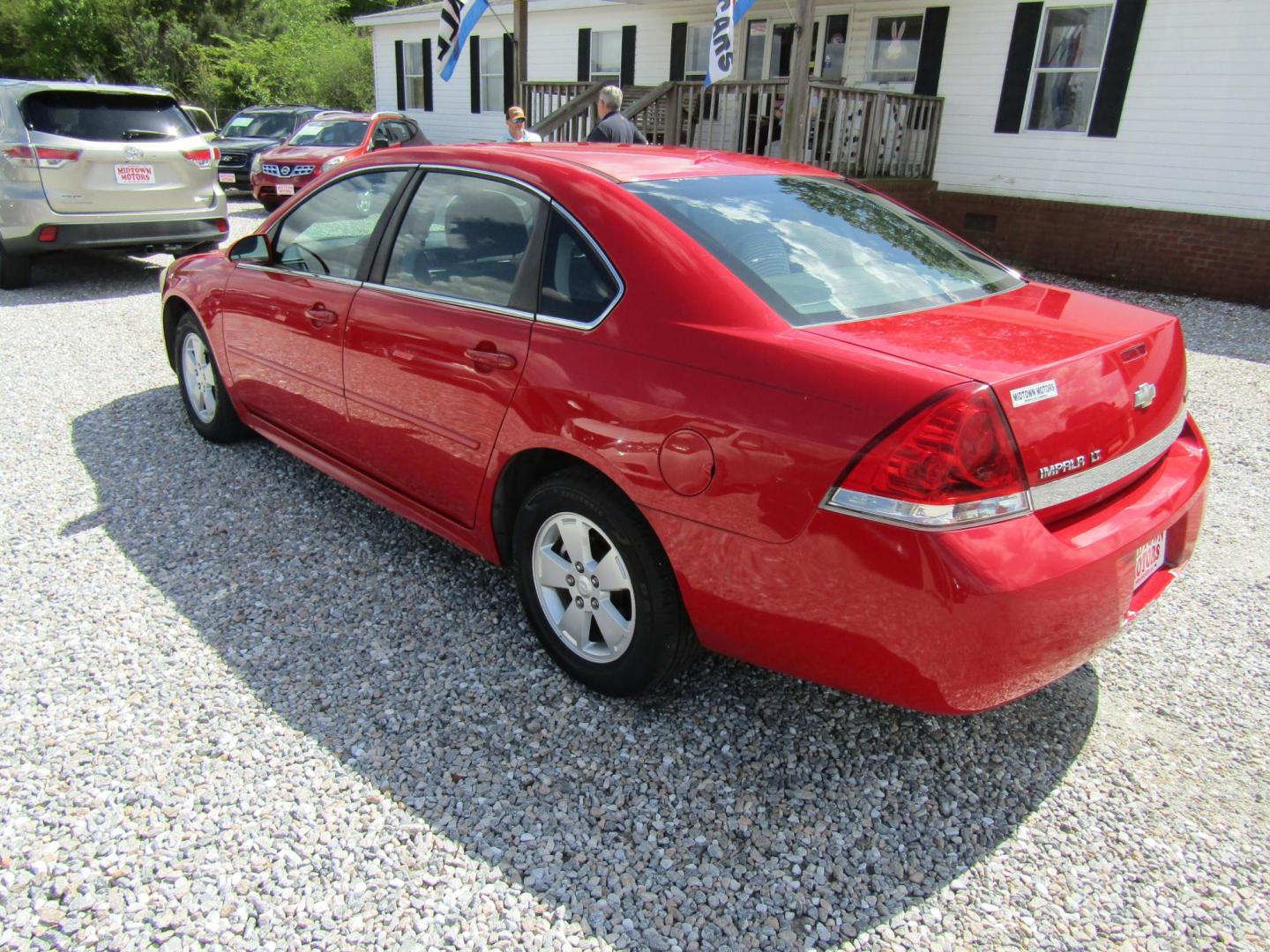 2011 Red Chevrolet Impala LT (2G1WG5EK9B1) with an 3.5L V6 OHV 16V FFV engine, Automatic transmission, located at 15016 S Hwy 231, Midland City, AL, 36350, (334) 983-3001, 31.306210, -85.495277 - Photo#1