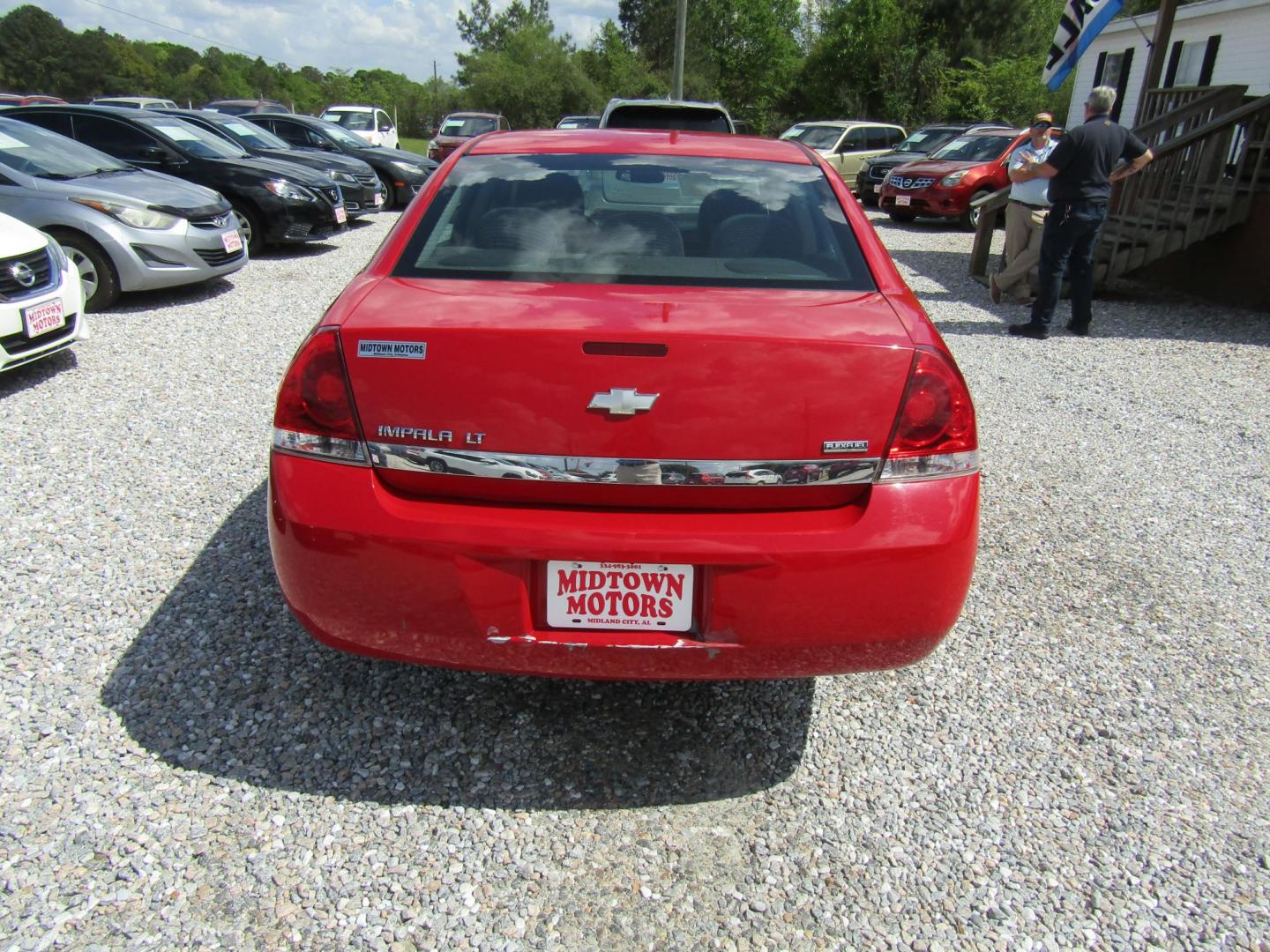 2011 Red Chevrolet Impala LT (2G1WG5EK9B1) with an 3.5L V6 OHV 16V FFV engine, Automatic transmission, located at 15016 S Hwy 231, Midland City, AL, 36350, (334) 983-3001, 31.306210, -85.495277 - Photo#2