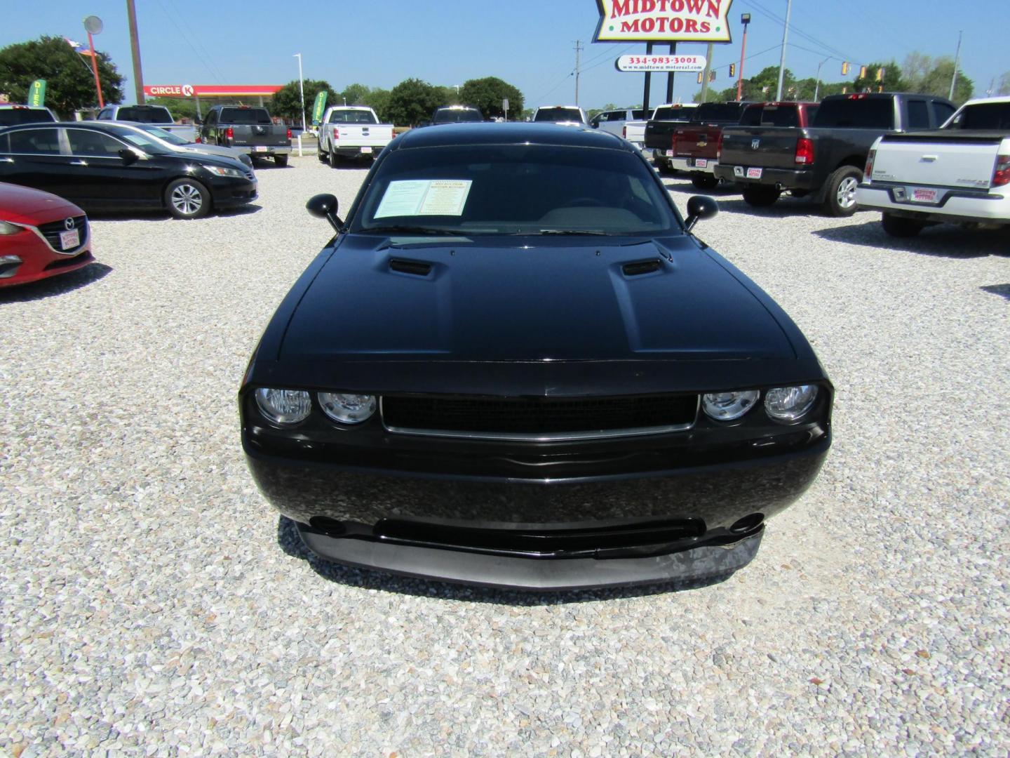 2013 Black Dodge Challenger SXT (2C3CDYAG4DH) with an 3.6L V6 DOHC 24V engine, Automatic transmission, located at 15016 S Hwy 231, Midland City, AL, 36350, (334) 983-3001, 31.306210, -85.495277 - Photo#1