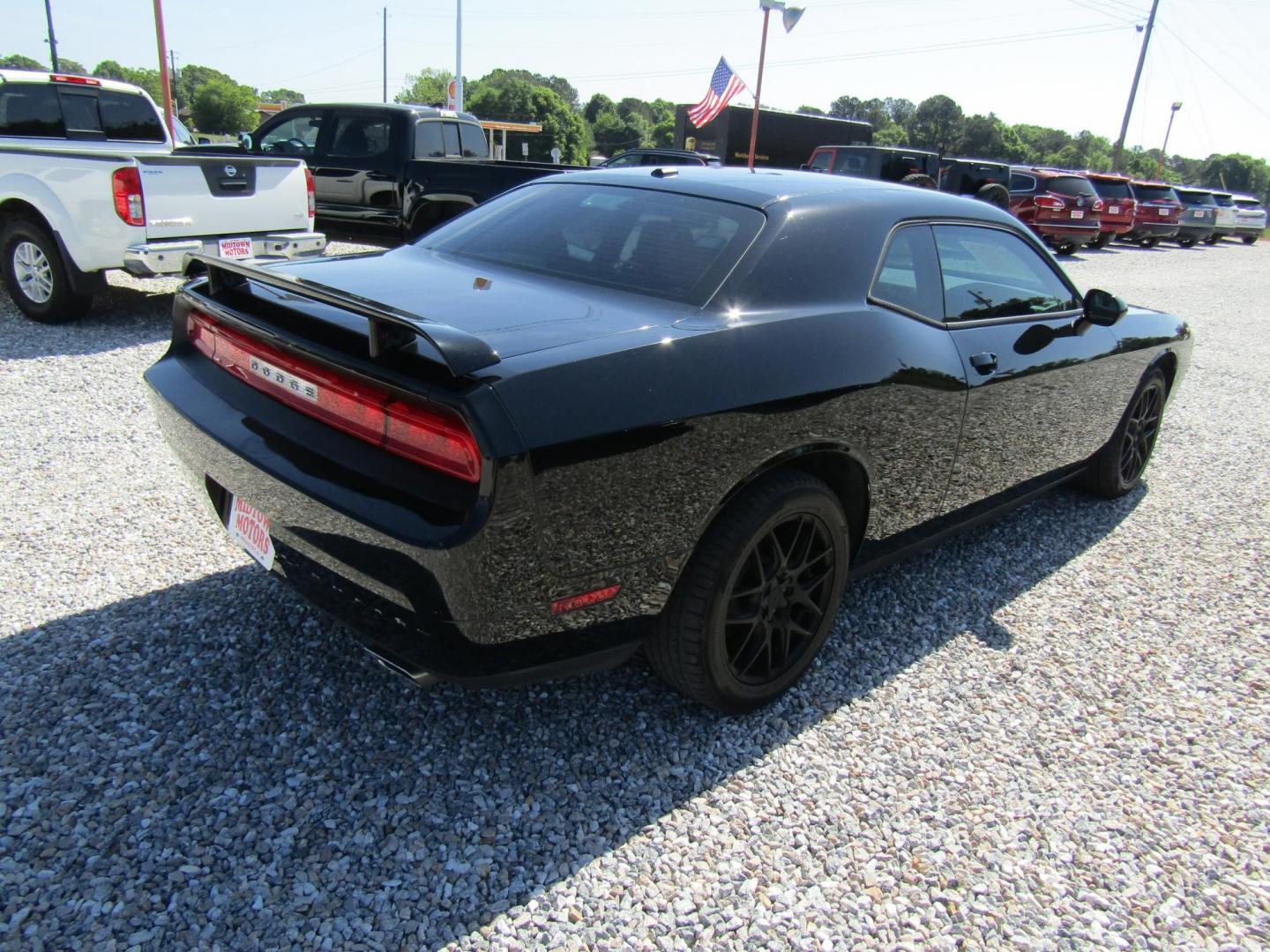 2013 Black Dodge Challenger SXT (2C3CDYAG4DH) with an 3.6L V6 DOHC 24V engine, Automatic transmission, located at 15016 S Hwy 231, Midland City, AL, 36350, (334) 983-3001, 31.306210, -85.495277 - Photo#6