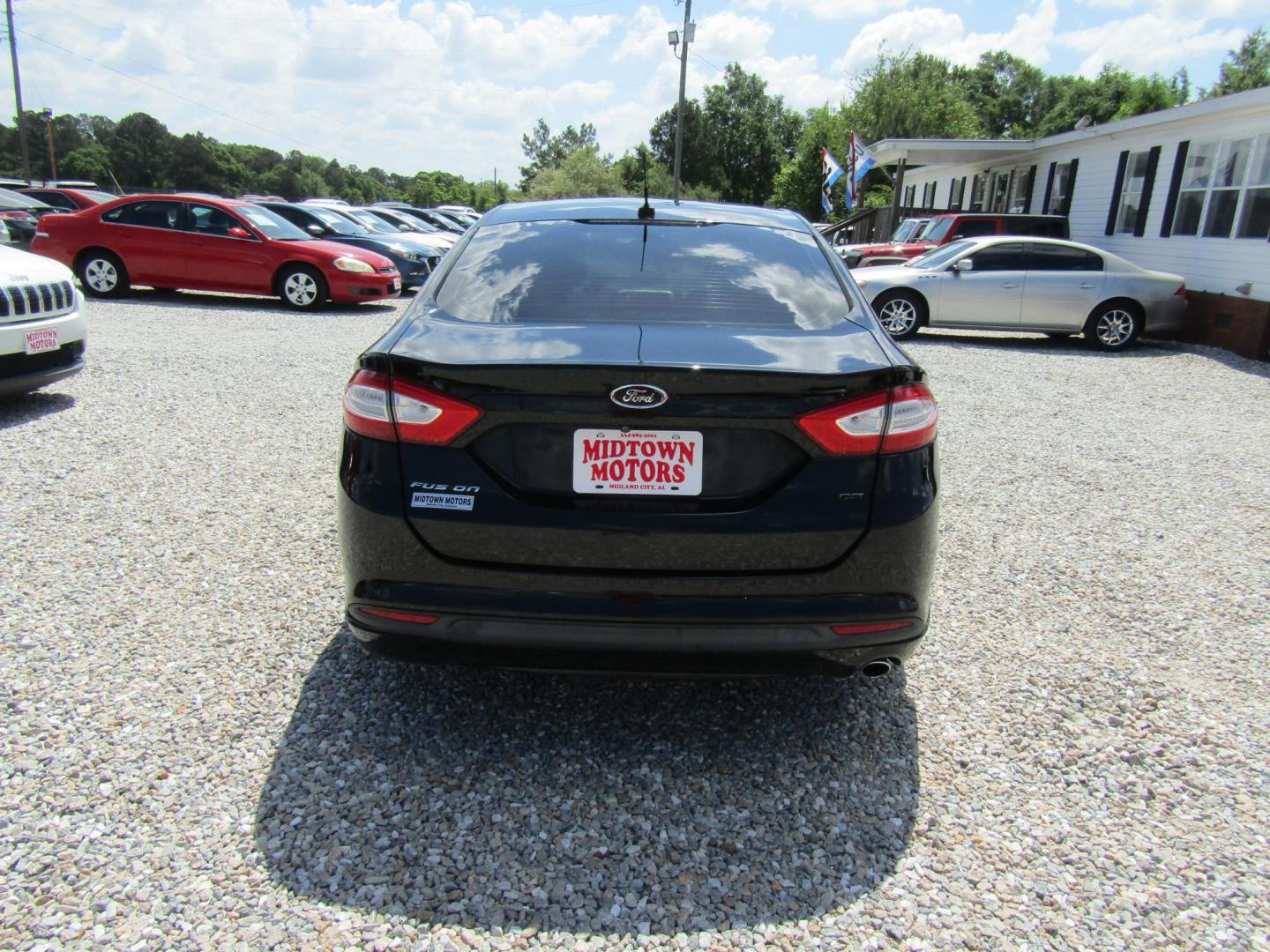 2016 Black Ford Fusion SE (3FA6P0H77GR) with an 2.5L L4 DOHC 16V engine, Automatic transmission, located at 15016 S Hwy 231, Midland City, AL, 36350, (334) 983-3001, 31.306210, -85.495277 - Photo#1