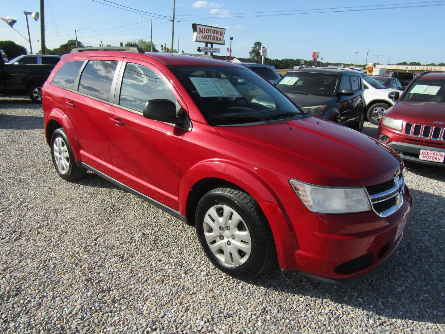 2017 Red Dodge Journey SE (3C4PDCAB5HT) with an 2.4L L4 DOHC 16V engine, Automatic transmission, located at 15016 S Hwy 231, Midland City, AL, 36350, (334) 983-3001, 31.306210, -85.495277 - Photo#0