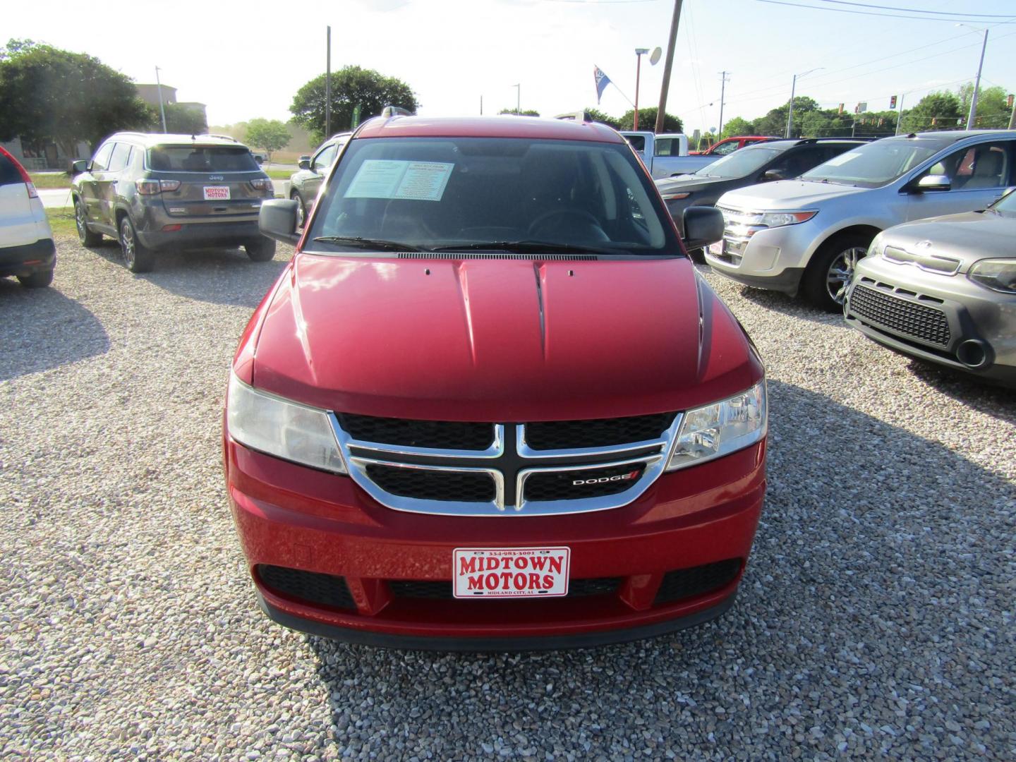 2017 Red Dodge Journey SE (3C4PDCAB5HT) with an 2.4L L4 DOHC 16V engine, Automatic transmission, located at 15016 S Hwy 231, Midland City, AL, 36350, (334) 983-3001, 31.306210, -85.495277 - Photo#1