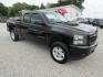 2010 Black Chevrolet Silverado 1500 LT1 Extended Cab 4WD (1GCSKSE35AZ) with an 5.3L V8 OHV 16V FFV engine, Automatic transmission, located at 15016 S Hwy 231, Midland City, AL, 36350, (334) 983-3001, 31.306210, -85.495277 - Photo#0