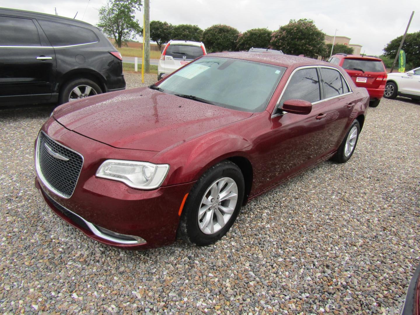 2015 Red Chrysler 300 Limited RWD (2C3CCAAG1FH) with an 3.6L V6 SOHC 24V engine, Automatic transmission, located at 15016 S Hwy 231, Midland City, AL, 36350, (334) 983-3001, 31.306210, -85.495277 - Photo#1