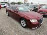 2015 Red Chrysler 300 Limited RWD (2C3CCAAG1FH) with an 3.6L V6 SOHC 24V engine, Automatic transmission, located at 15016 S Hwy 231, Midland City, AL, 36350, (334) 983-3001, 31.306210, -85.495277 - Photo#0