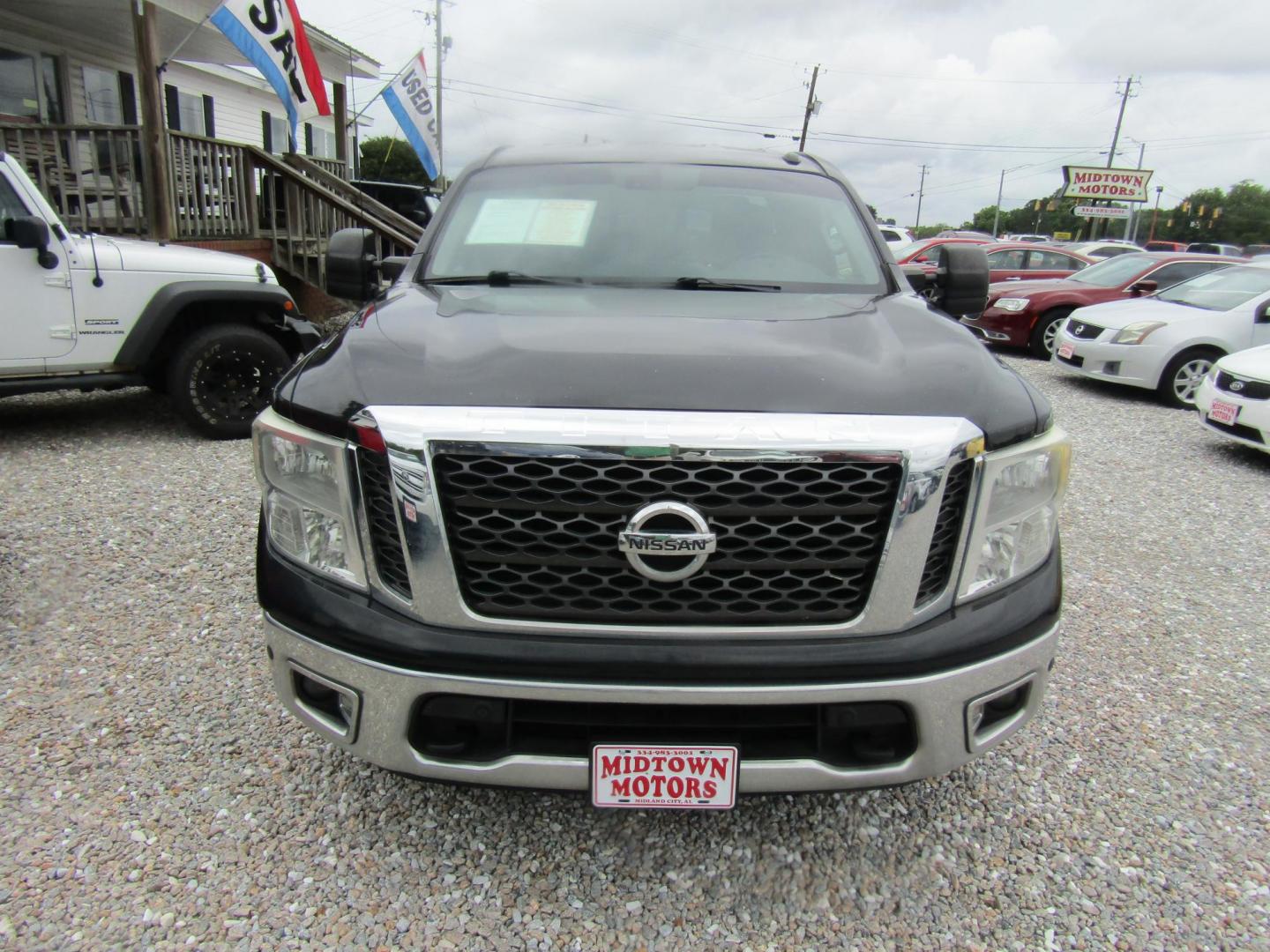 2017 Black Nissan Titan S King Cab 2WD (1N6AA1C62HN) with an 5.6L V8 DOHC 32V engine, Automatic transmission, located at 15016 S Hwy 231, Midland City, AL, 36350, (334) 983-3001, 31.306210, -85.495277 - Photo#1