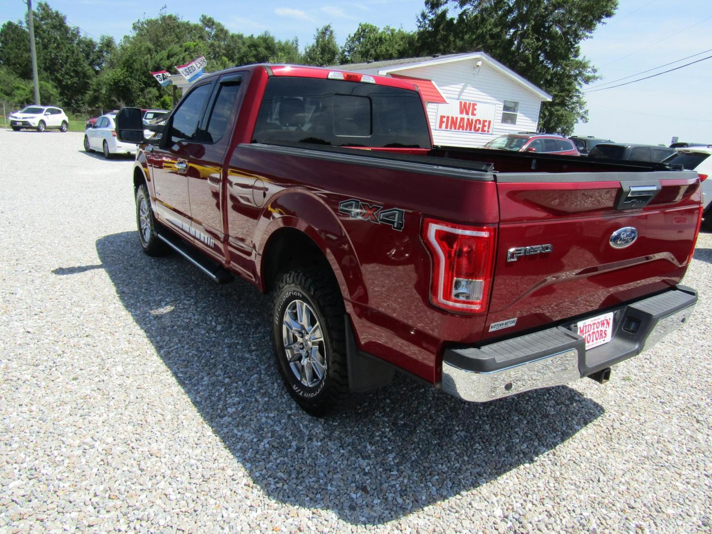 2015 Red Ford F-150 Lariat SuperCab 6.5-ft. Bed 4WD (1FTEX1EP1FF) with an 2.7L V6 DOHC 24V engine, Automatic transmission, located at 15016 S Hwy 231, Midland City, AL, 36350, (334) 983-3001, 31.306210, -85.495277 - Photo#4