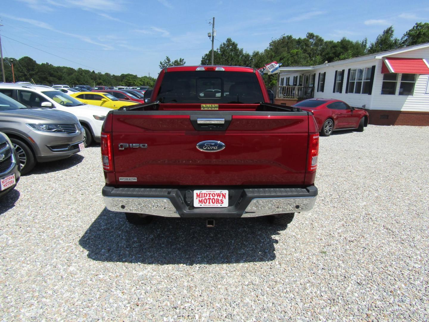 2015 Red Ford F-150 Lariat SuperCab 6.5-ft. Bed 4WD (1FTEX1EP1FF) with an 2.7L V6 DOHC 24V engine, Automatic transmission, located at 15016 S Hwy 231, Midland City, AL, 36350, (334) 983-3001, 31.306210, -85.495277 - Photo#5