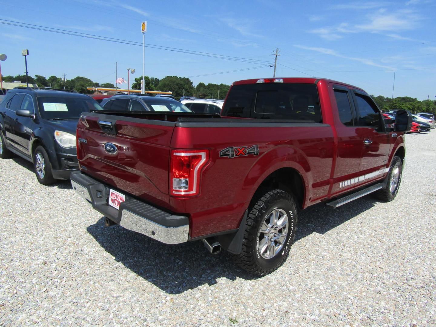 2015 Red Ford F-150 Lariat SuperCab 6.5-ft. Bed 4WD (1FTEX1EP1FF) with an 2.7L V6 DOHC 24V engine, Automatic transmission, located at 15016 S Hwy 231, Midland City, AL, 36350, (334) 983-3001, 31.306210, -85.495277 - Photo#6