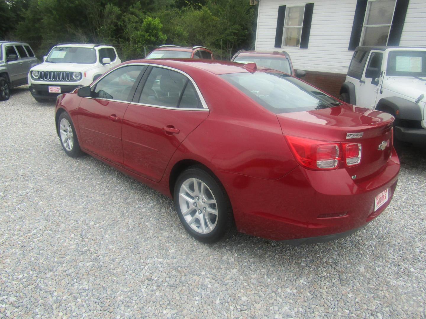 2014 Red Chevrolet Malibu 1LT (1G11C5SL0EF) with an 2.5L L4 DOHC 16V engine, Automatic transmission, located at 15016 S Hwy 231, Midland City, AL, 36350, (334) 983-3001, 31.306210, -85.495277 - Photo#4