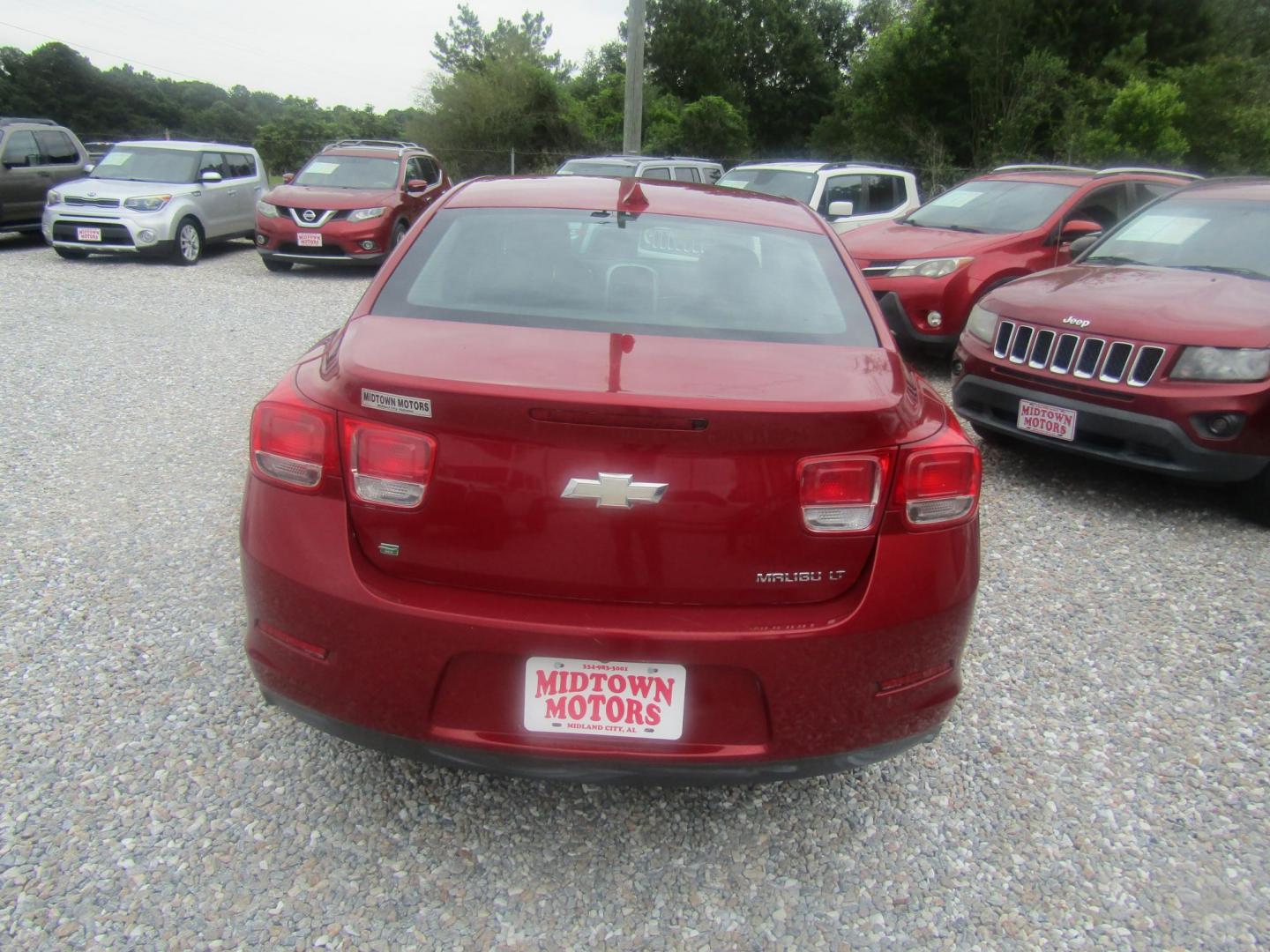 2014 Red Chevrolet Malibu 1LT (1G11C5SL0EF) with an 2.5L L4 DOHC 16V engine, Automatic transmission, located at 15016 S Hwy 231, Midland City, AL, 36350, (334) 983-3001, 31.306210, -85.495277 - Photo#5