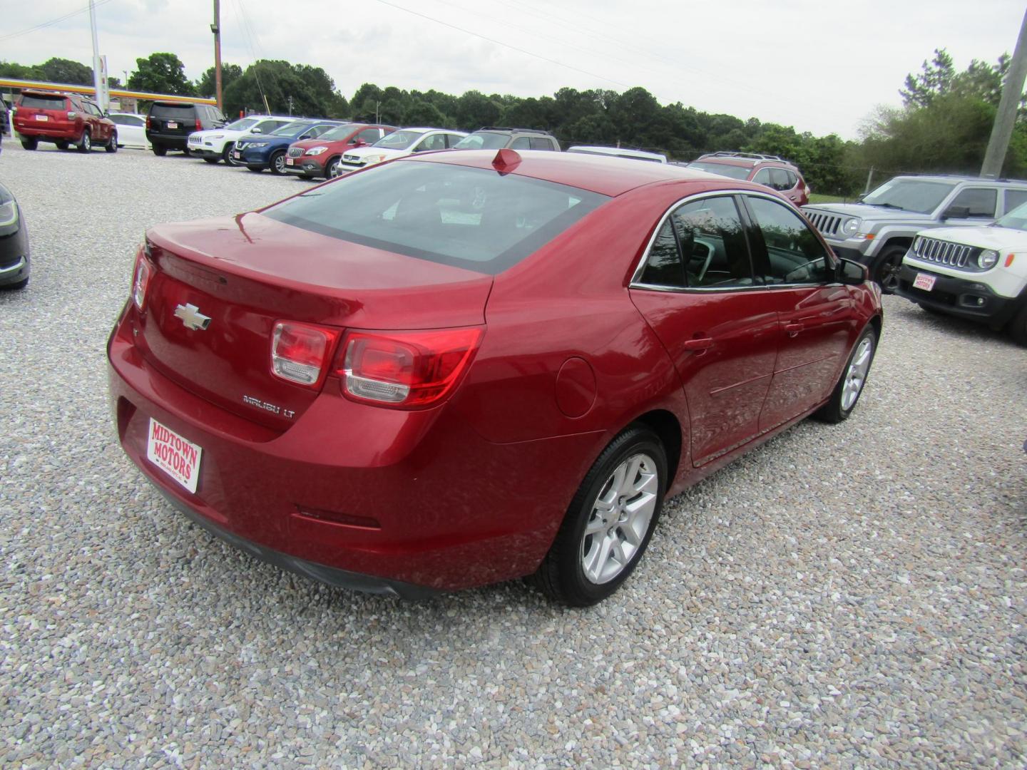 2014 Red Chevrolet Malibu 1LT (1G11C5SL0EF) with an 2.5L L4 DOHC 16V engine, Automatic transmission, located at 15016 S Hwy 231, Midland City, AL, 36350, (334) 983-3001, 31.306210, -85.495277 - Photo#6