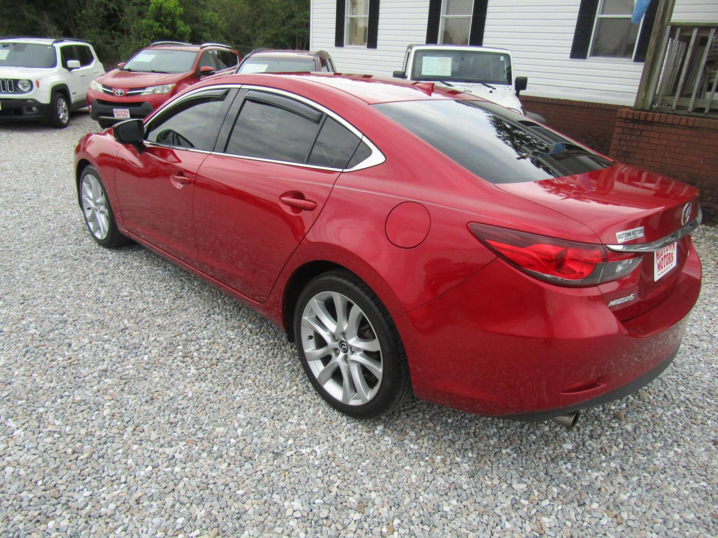 2017 Red Mazda Mazda6 i Touring AT (JM1GL1V51H1) with an 2.5L L4 DOHC 16V engine, Automatic transmission, located at 15016 S Hwy 231, Midland City, AL, 36350, (334) 983-3001, 31.306210, -85.495277 - Photo#4