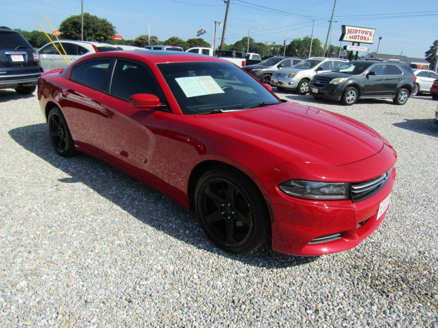2015 Red Dodge Charger SE (2C3CDXBG8FH) with an 3.6L V6 DOHC 24V engine, Automatic transmission, located at 15016 S Hwy 231, Midland City, AL, 36350, (334) 983-3001, 31.306210, -85.495277 - Photo#0