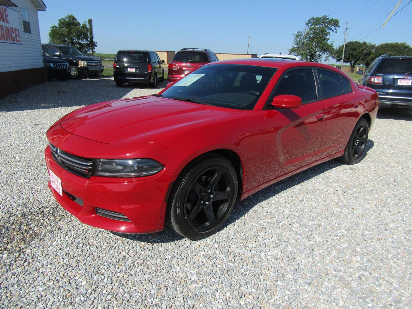 2015 Red Dodge Charger SE (2C3CDXBG8FH) with an 3.6L V6 DOHC 24V engine, Automatic transmission, located at 15016 S Hwy 231, Midland City, AL, 36350, (334) 983-3001, 31.306210, -85.495277 - Photo#2