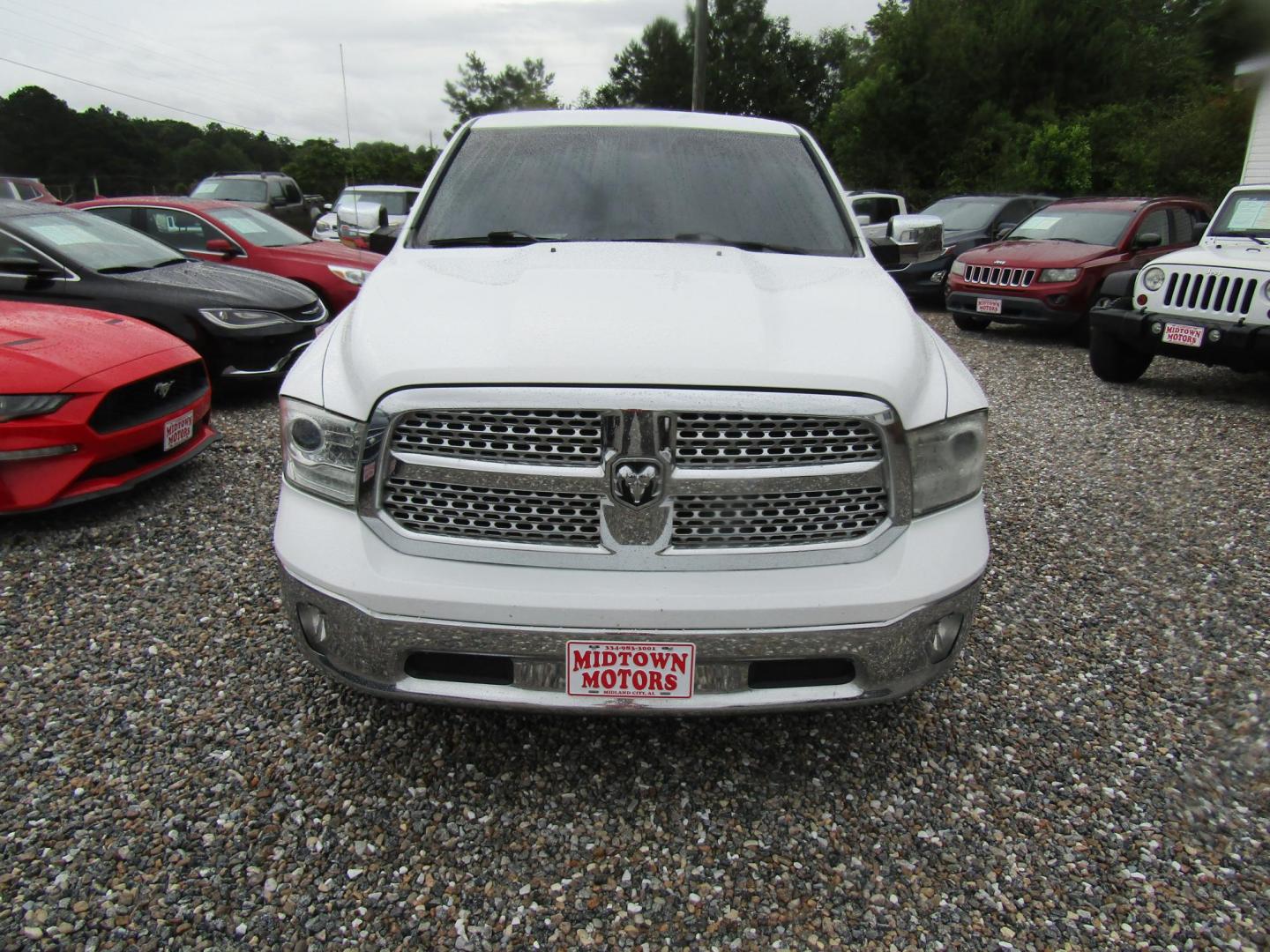 2017 White RAM 1500 Laramie Quad Cab 2WD (1C6RR6JT0HS) with an 5.7L V8 OHV 16V engine, Automatic transmission, located at 15016 S Hwy 231, Midland City, AL, 36350, (334) 983-3001, 31.306210, -85.495277 - Photo#1