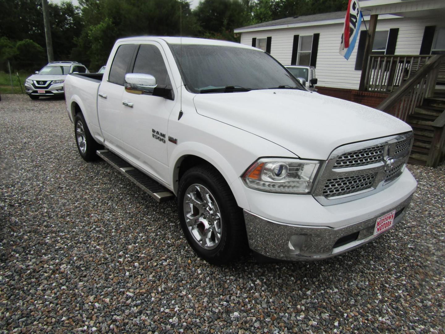 2017 White RAM 1500 Laramie Quad Cab 2WD (1C6RR6JT0HS) with an 5.7L V8 OHV 16V engine, Automatic transmission, located at 15016 S Hwy 231, Midland City, AL, 36350, (334) 983-3001, 31.306210, -85.495277 - Photo#0