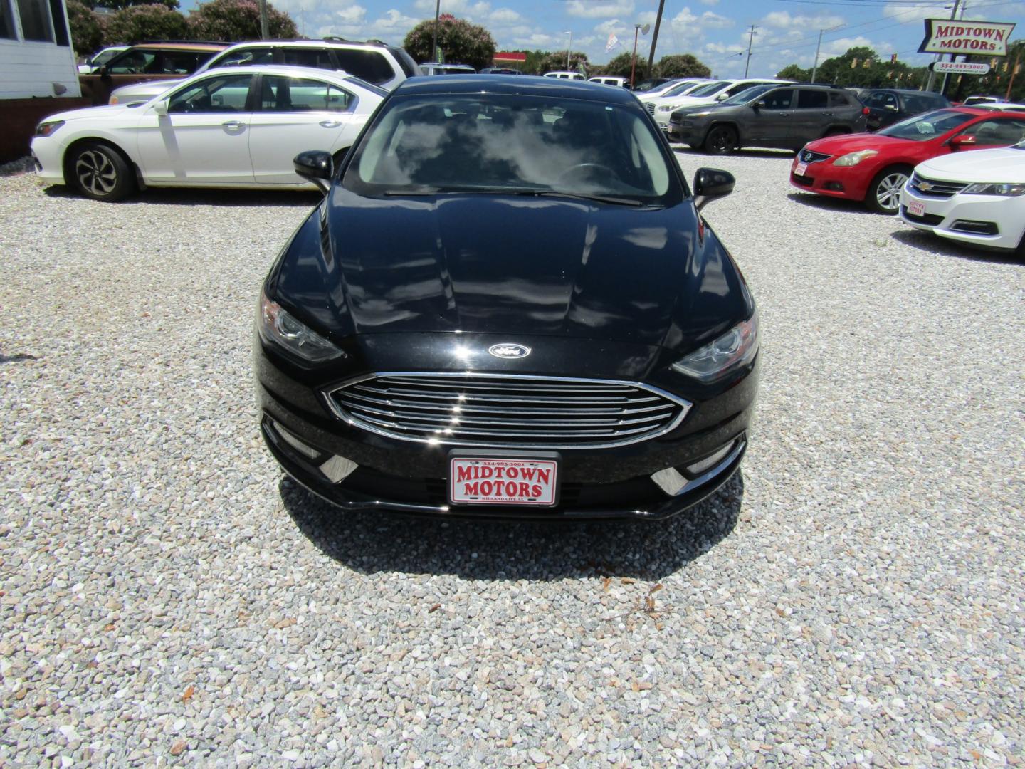 2018 Black Ford Fusion S (3FA6P0G70JR) with an 2.5L L4 DOHC 16V engine, Automatic transmission, located at 15016 S Hwy 231, Midland City, AL, 36350, (334) 983-3001, 31.306210, -85.495277- Photo#1