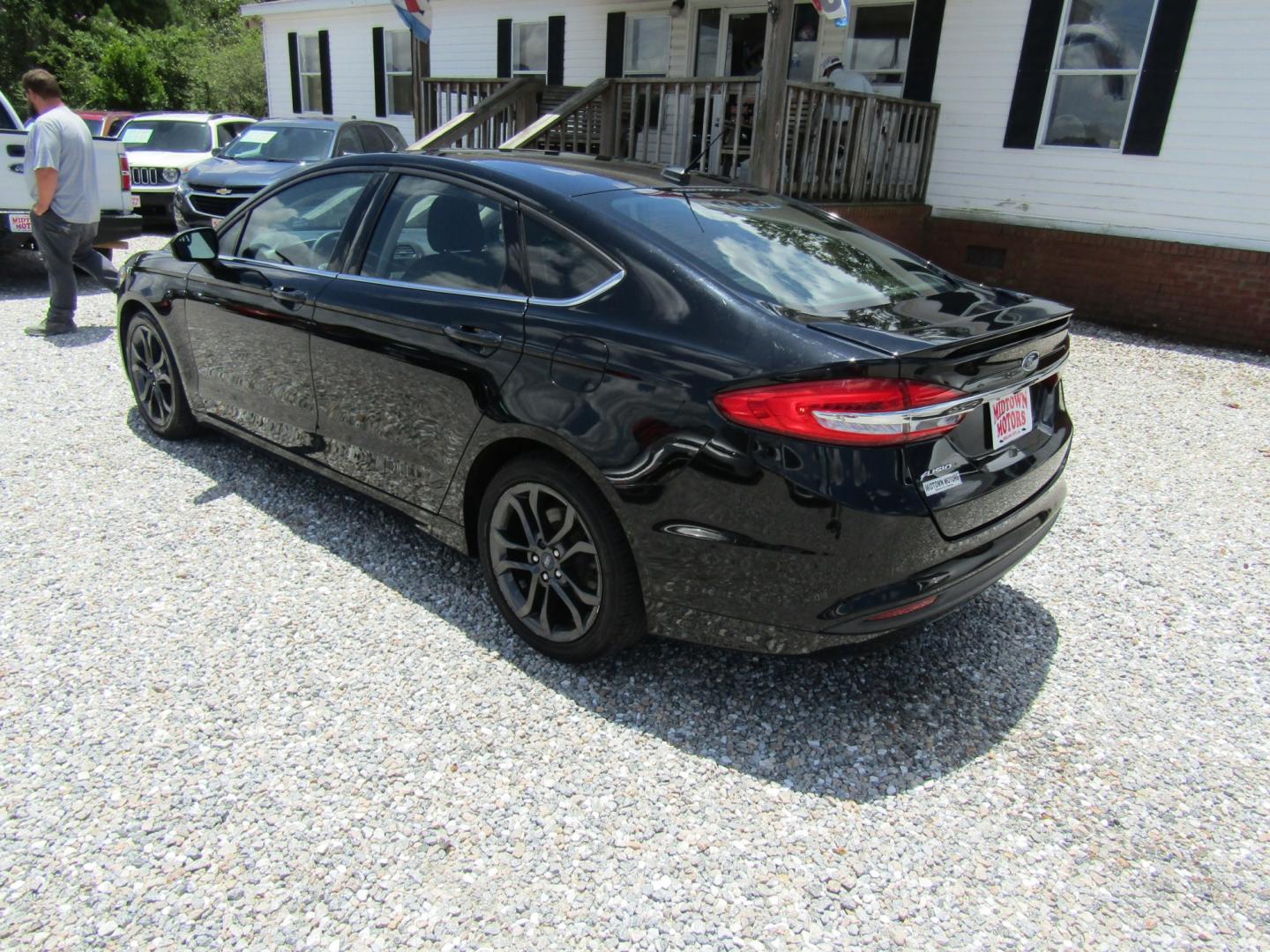 2018 Black Ford Fusion S (3FA6P0G70JR) with an 2.5L L4 DOHC 16V engine, Automatic transmission, located at 15016 S Hwy 231, Midland City, AL, 36350, (334) 983-3001, 31.306210, -85.495277- Photo#5
