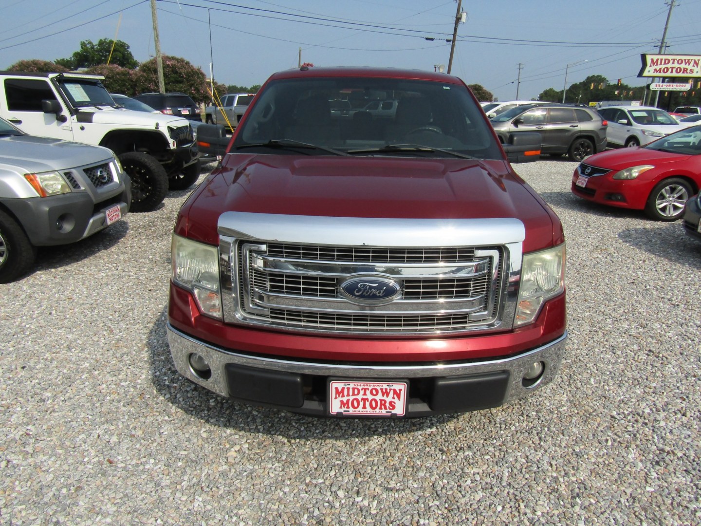 2014 Red Ford F-150 XLT SuperCab 8-ft. Bed 2WD (1FTEX1CM0EF) with an 3.7L V6 DOHC 24V engine, Automatic transmission, located at 15016 S Hwy 231, Midland City, AL, 36350, (334) 983-3001, 31.306210, -85.495277- Photo#1