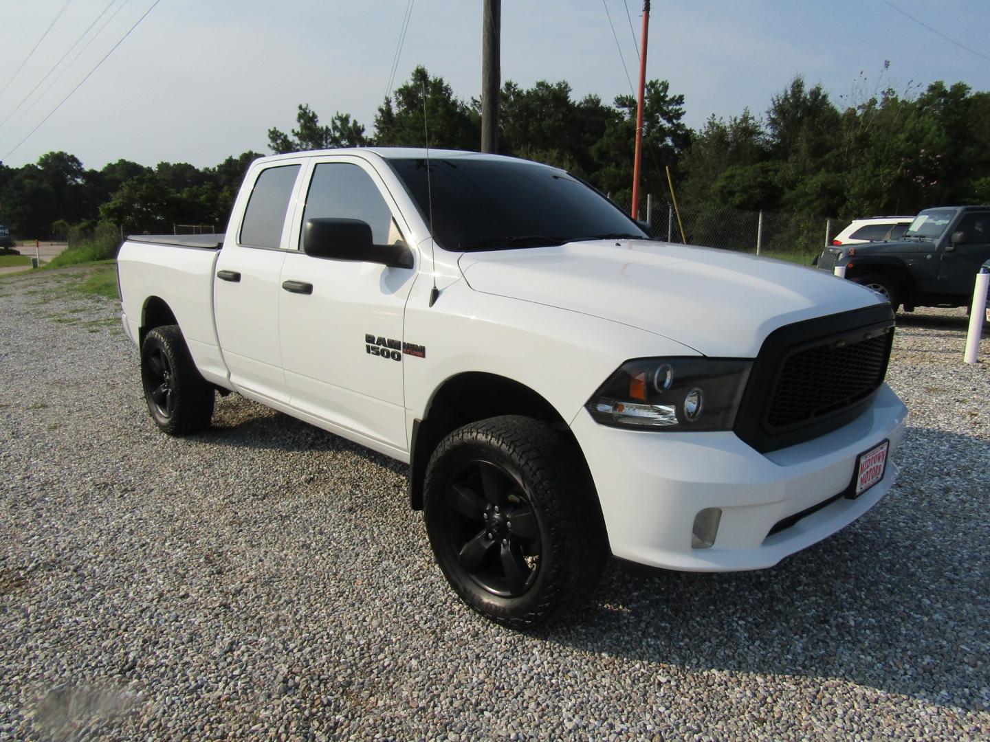 2018 White RAM 1500 Tradesman Quad Cab 4WD (1C6RR7FT2JS) with an 5.7L V8 OHV 16V engine, Automatic transmission, located at 15016 S Hwy 231, Midland City, AL, 36350, (334) 983-3001, 31.306210, -85.495277- Photo#0