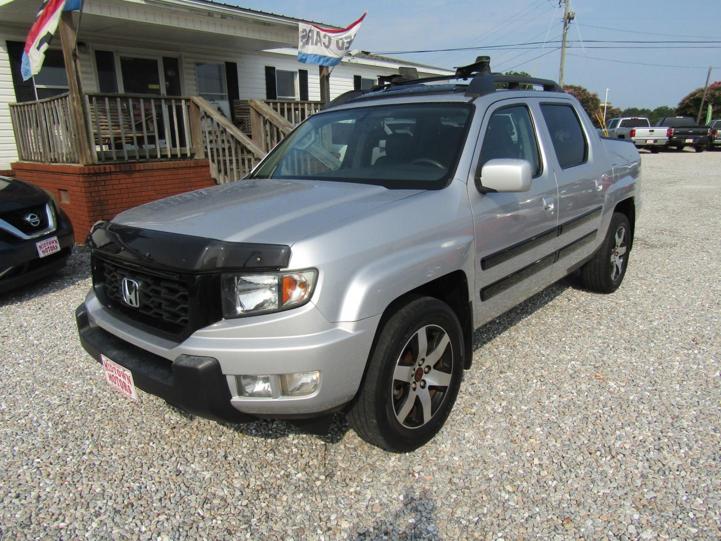 2014 Silver Honda Ridgeline RTL-S (5FPYK1F6XEB) with an 3.5L V6 SOHC 24V engine, Automatic transmission, located at 15016 S Hwy 231, Midland City, AL, 36350, (334) 983-3001, 31.306210, -85.495277- Photo#2