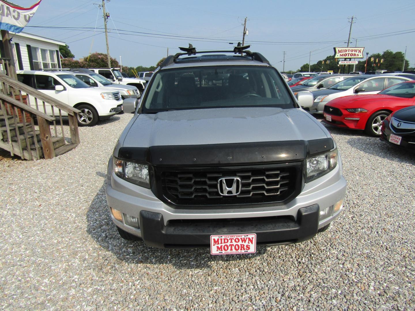 2014 Silver Honda Ridgeline RTL-S (5FPYK1F6XEB) with an 3.5L V6 SOHC 24V engine, Automatic transmission, located at 15016 S Hwy 231, Midland City, AL, 36350, (334) 983-3001, 31.306210, -85.495277- Photo#1