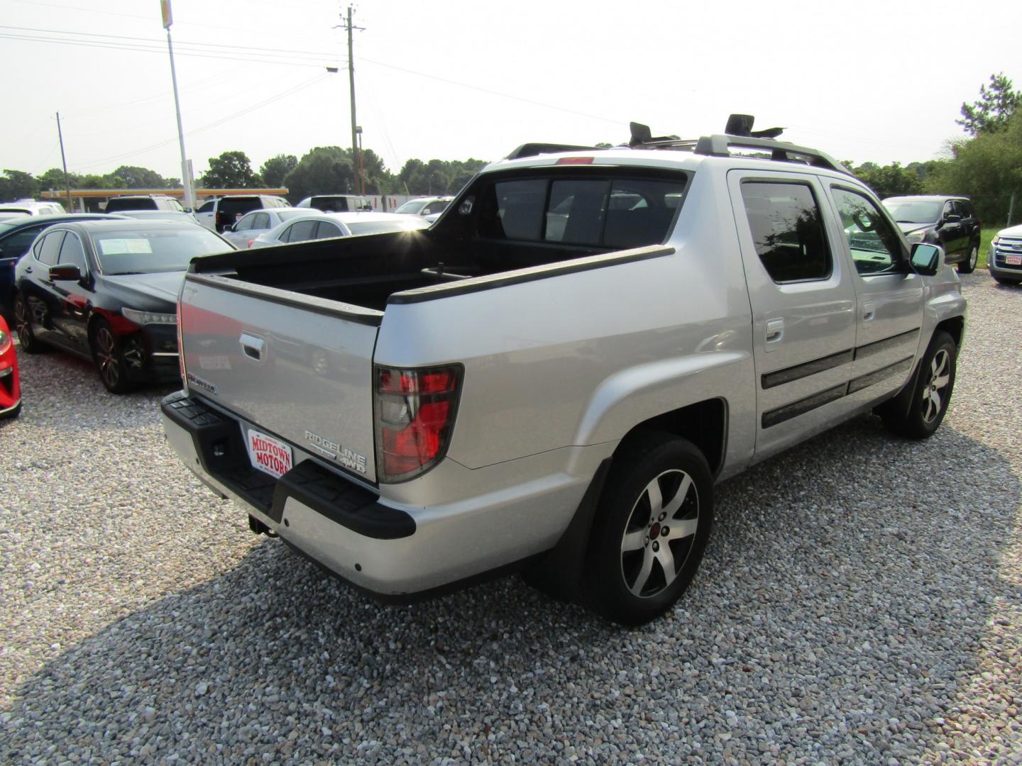 2014 Silver Honda Ridgeline RTL-S (5FPYK1F6XEB) with an 3.5L V6 SOHC 24V engine, Automatic transmission, located at 15016 S Hwy 231, Midland City, AL, 36350, (334) 983-3001, 31.306210, -85.495277- Photo#7